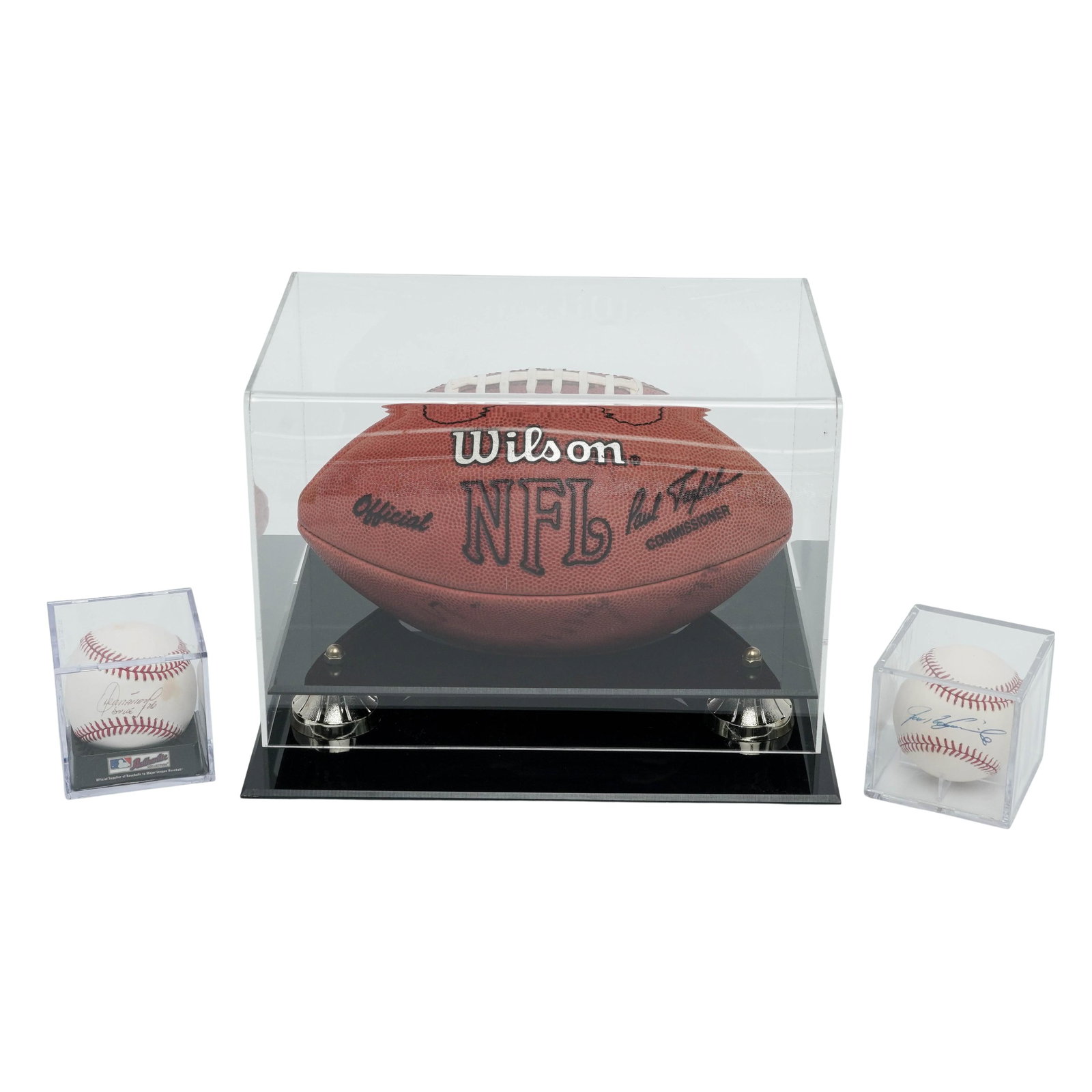 (3 Pc) Grouping of Autographed Sports Memorabilia: (3 Pc) Grouping of Autographed Sports Memorabilia Late 20th Century, USA Group of three autographed items comprising two baseballs and one Wilson NFL football, each housed in protective display cases.