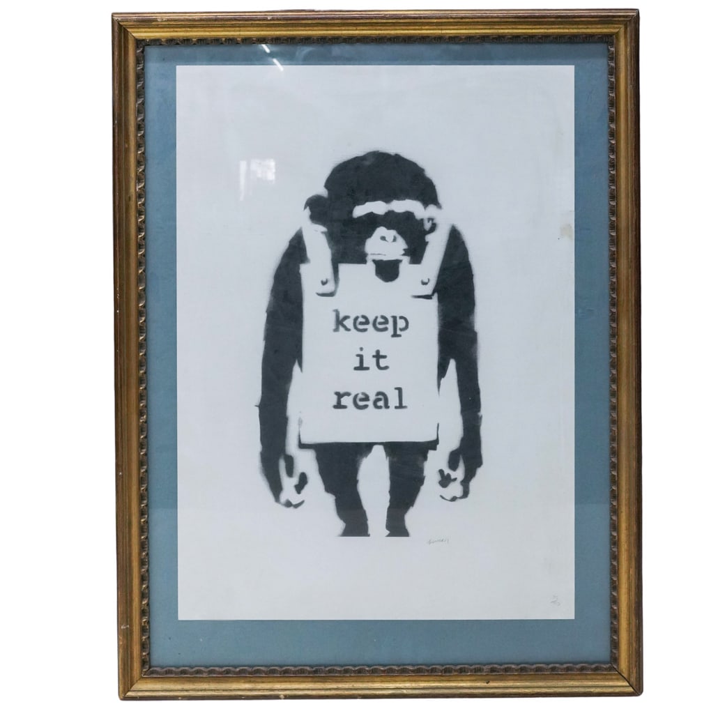 Banksy (British, 1973-) 'Keep It Real' Lithograph: Banksy (British, 1973- ) 'Keep It Real' Lithograph 21st Century, England. Black and white print depicting a chimpanzee wearing a sandwich board reading “keep it real,” after the iconic street 