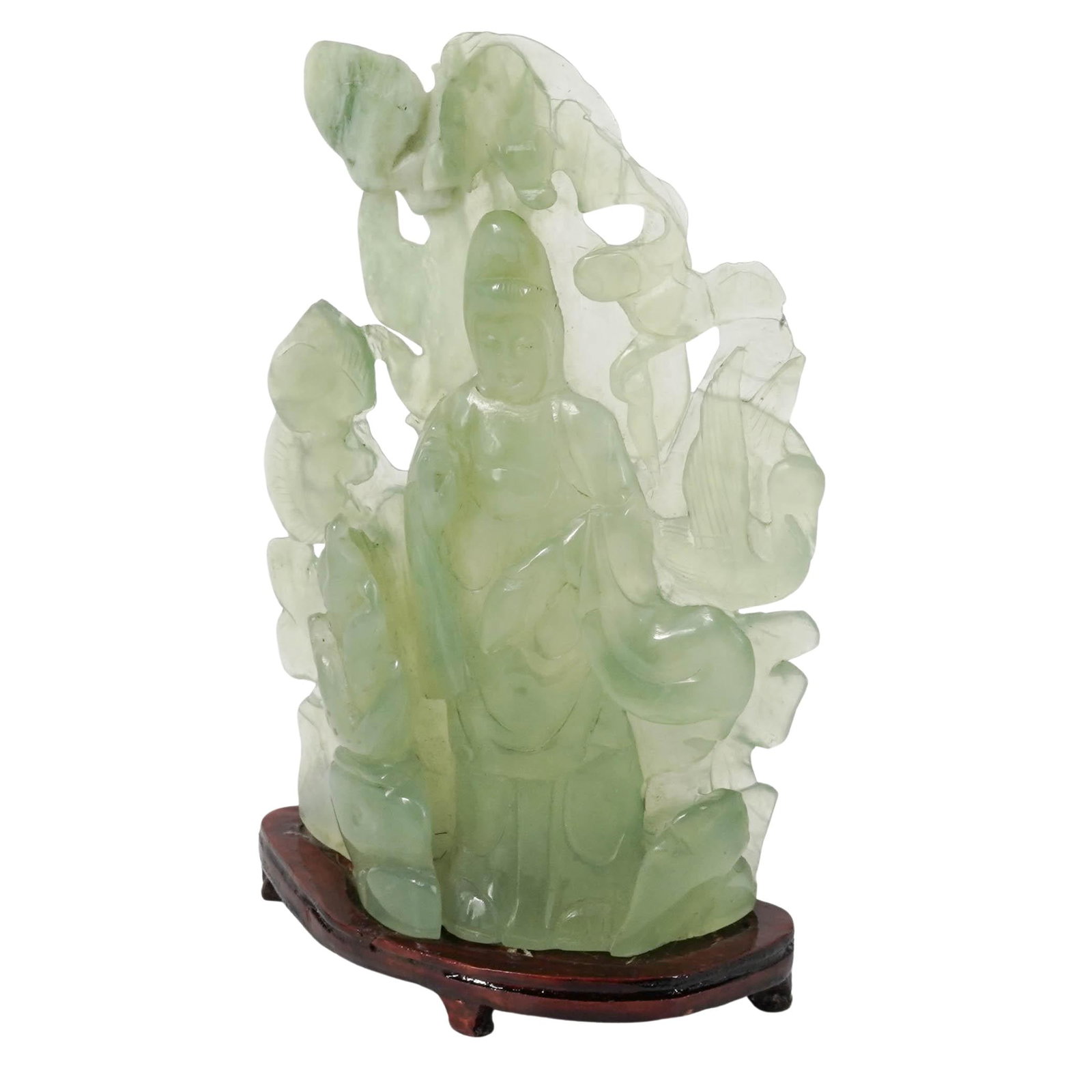 Antique Chinese Jade Guanyin Sculpture: Antique Chinese Jade Guanyin Sculpture 20th Century, China. Carved hardstone figure depicting Guanyin, shown standing in flowing robes and set against a pierced naturalistic backdrop. Executed in pale