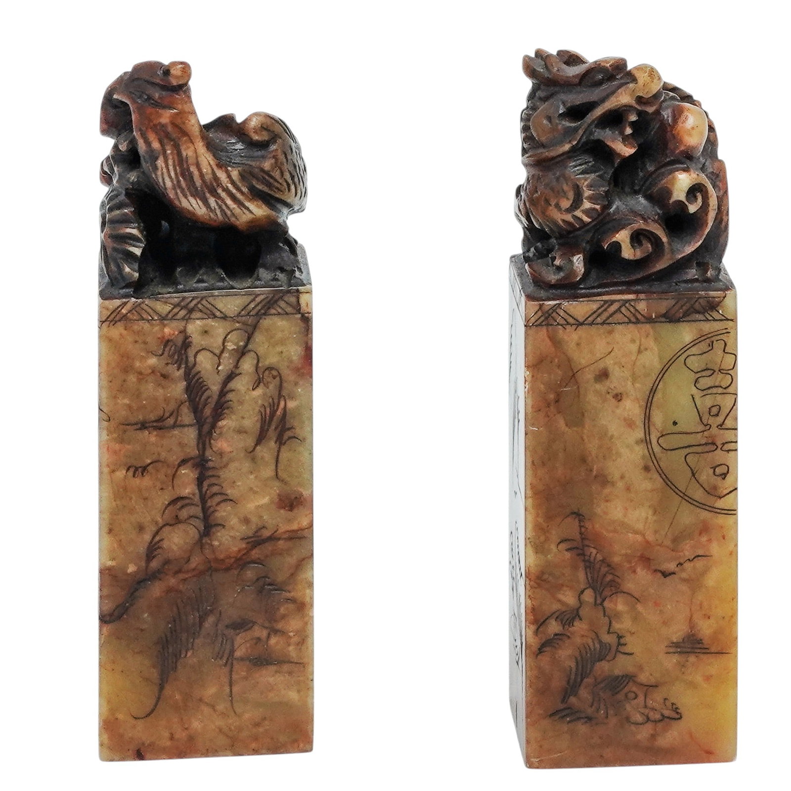 Pair of Chinese Shoushan Soapstone Phoenix & Dragon Wax Stamps: Pair of Chinese Shoushan Soapstone Phoenix & Dragon Wax Stamps 20th Century, China. Pair of Chinese carved Shoushan soapstone seal stamps, each surmounted by a finely detailed mythical creature, inclu