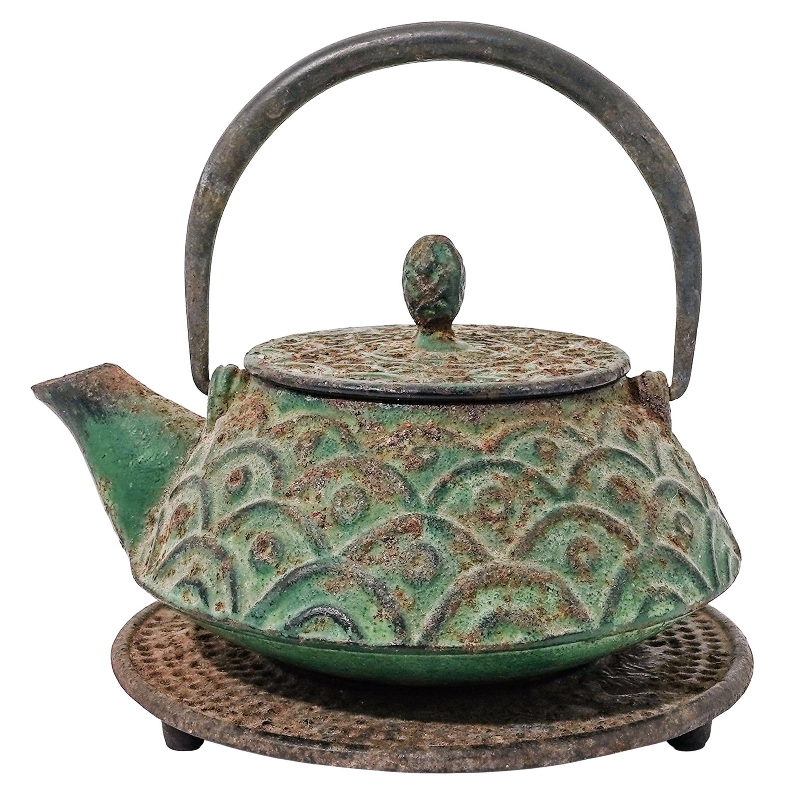 Japanese Nambu Ironware Tetsubin Kettle & Trivet: Japanese Nambu Ironware Tetsubin Kettle & Trivet Mid 20th c., Japan Vintage Japanese Nambu cast-iron teapot with a swinging handle featuring a green verdigris finish and a distinctive scale pattern. A