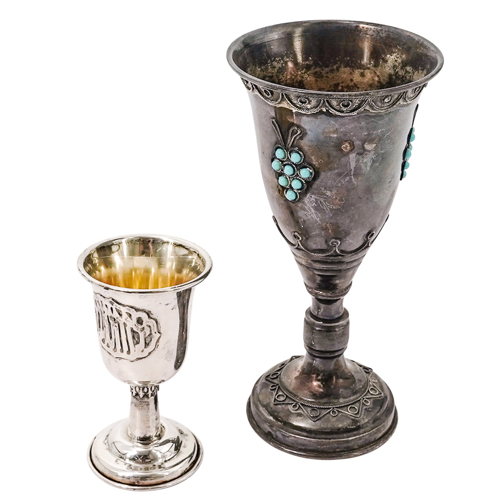 (2pc) Judiaca Sterling Silver Kiddush Cups: (2pc) Judiaca Sterling Silver Kiddush Cups 20th Cent. Israeli This lot features two distinct Jewish sterling silver Kiddush cups, each showcasing unique regional craftsmanship. The group includes: (1)