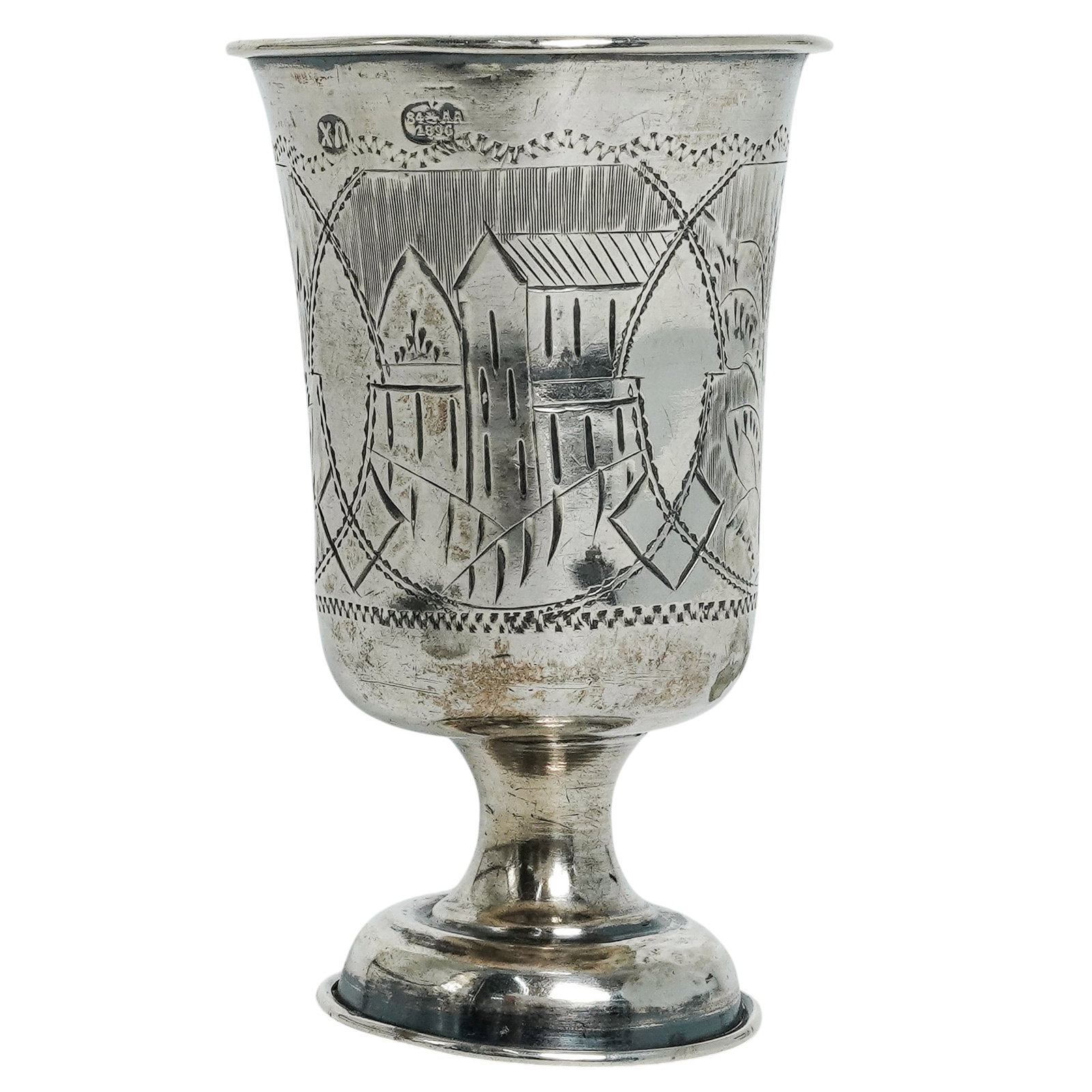 Antique Russian Silver Kiddush Cup: Antique Russian Silver Kiddush Cup Late 19th Century, Russia Silver Kiddush cup of traditional form, featuring a flared bowl raised on a circular pedestal foot. The body is engraved with foliate and g