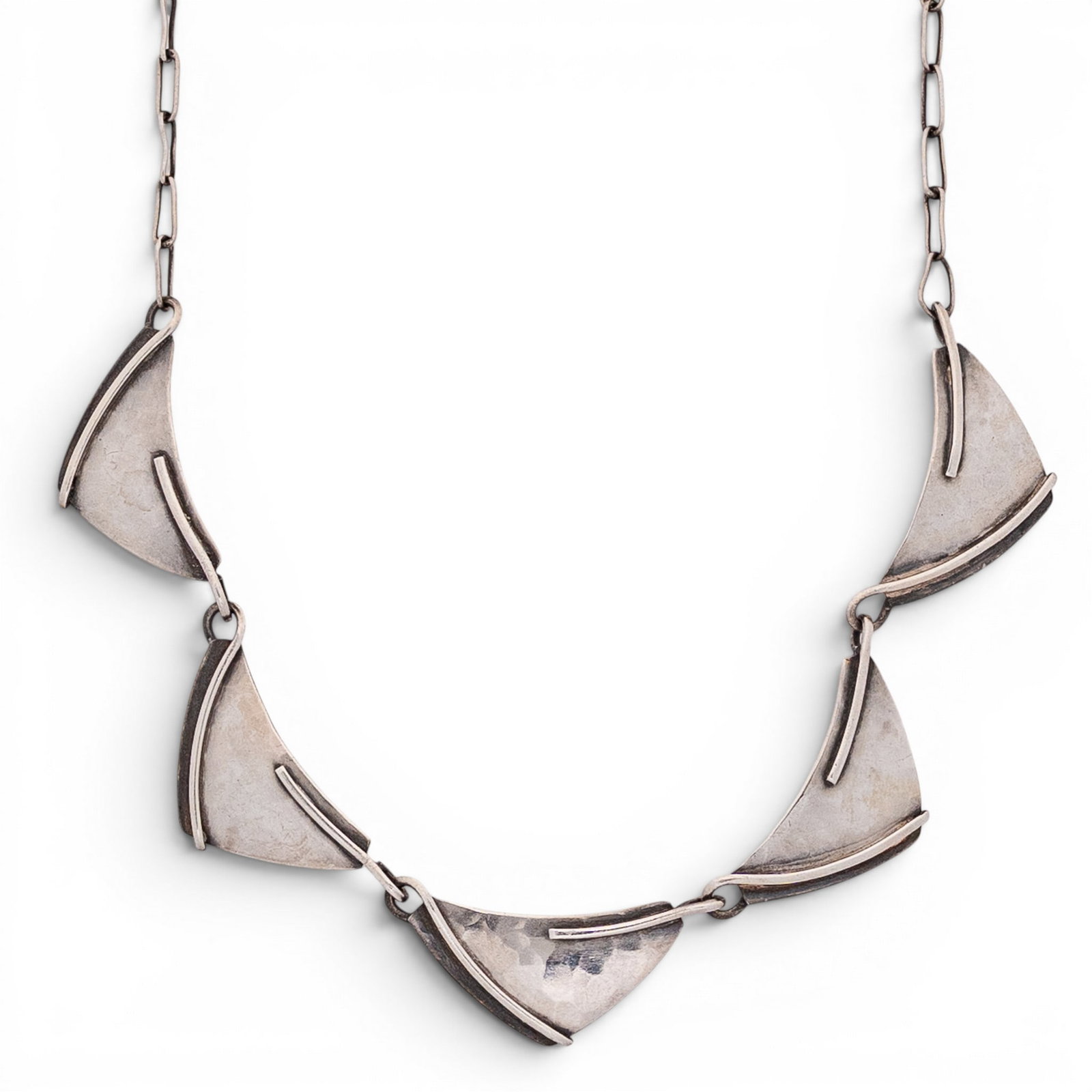 Sterling Silver Modernist Hammered Panel Necklace: Sterling Silver Modernist Hammered Panel Necklace 1970s-1980s Sterling silver modernist necklace featuring articulated curved fan-form panels with hammered texture and raised bar accents, joined to an