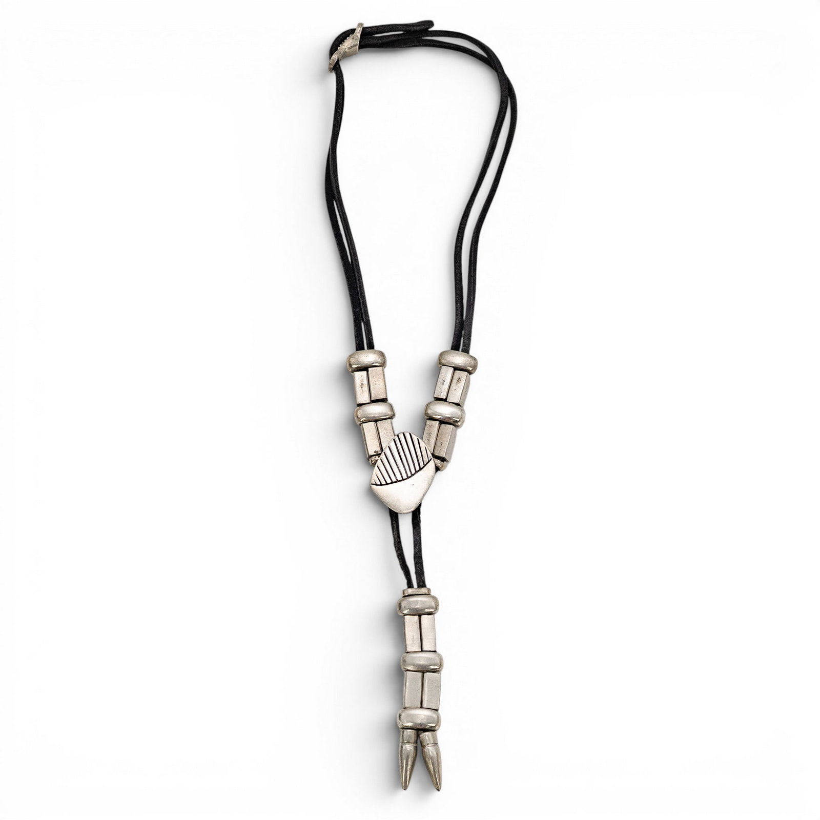 Vintage Southwestern Style Silver Tone Bolo Tie: Vintage Southwestern Style Silver Tone Bolo Tie Late 20th Century, USA Vintage southwestern style bolo tie featuring black cord with silver tone metal slide, geometric bead accents, and pointed metal 