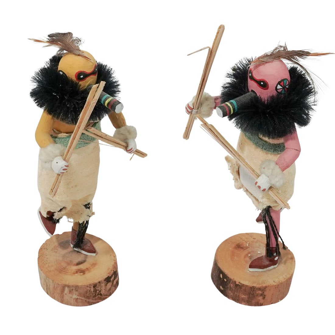 (2 Pc) Alvin Leon Zuni Warrior Guard Kachina Dolls: (2 Pc) Alvin Leon Zuni Warrior Guard Kachina Dolls Late 20th-21st c., USA Handmade Zuni Warrior Guard Kachina dolls carved from wood and painted in vibrant colors, with feathers, faux fur, and cloth d