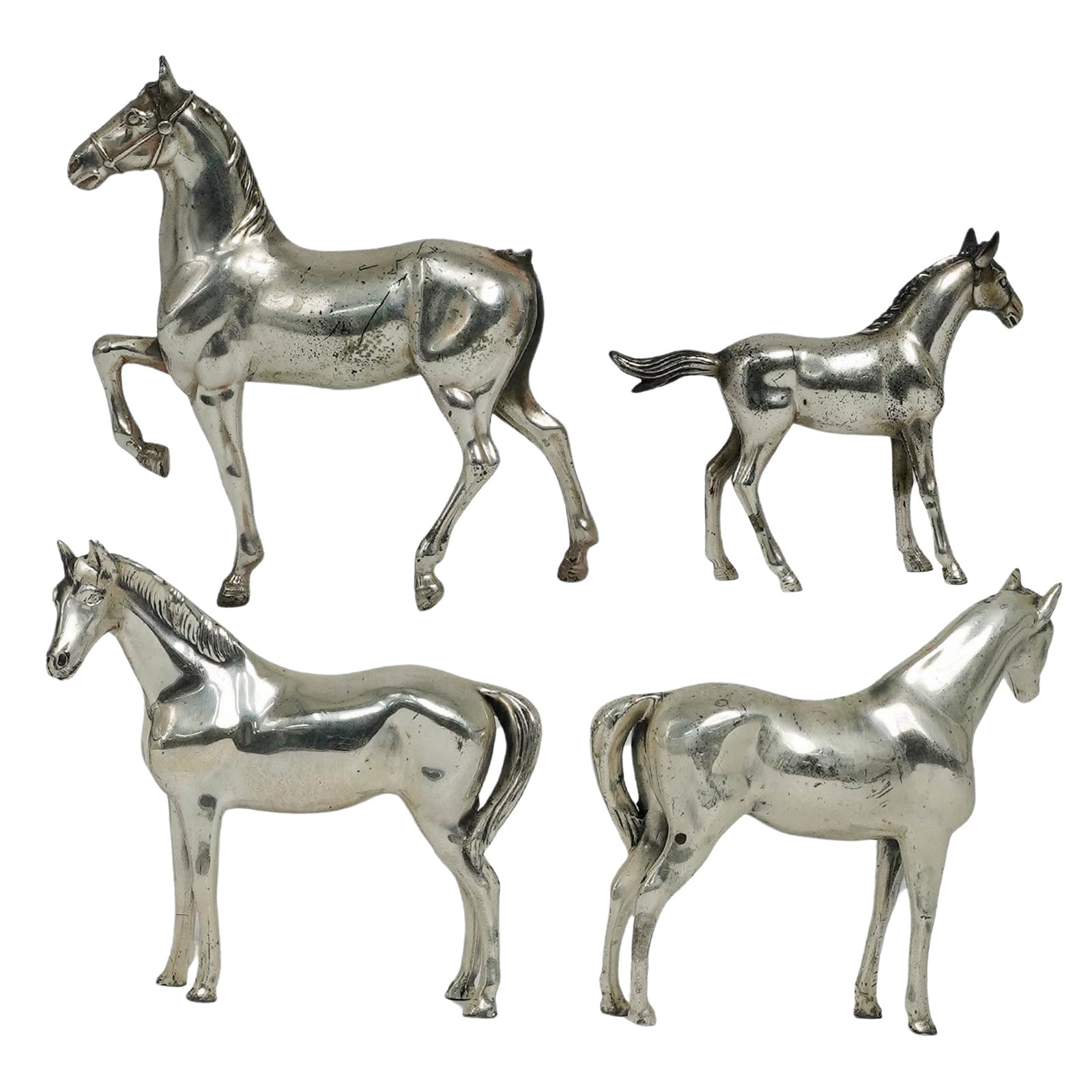 (4 Pc) Philadelphia Mfg Co. Silver Metal Horse Figurines: (4 Pc) Philadelphia Mfg Co. Silver Metal Horse Figurines Mid 20th c., USA/Japan Philadelphia Manufacturing Company silvered metal horse figurines. Two are marked "PMC" on the undersides, and two are m