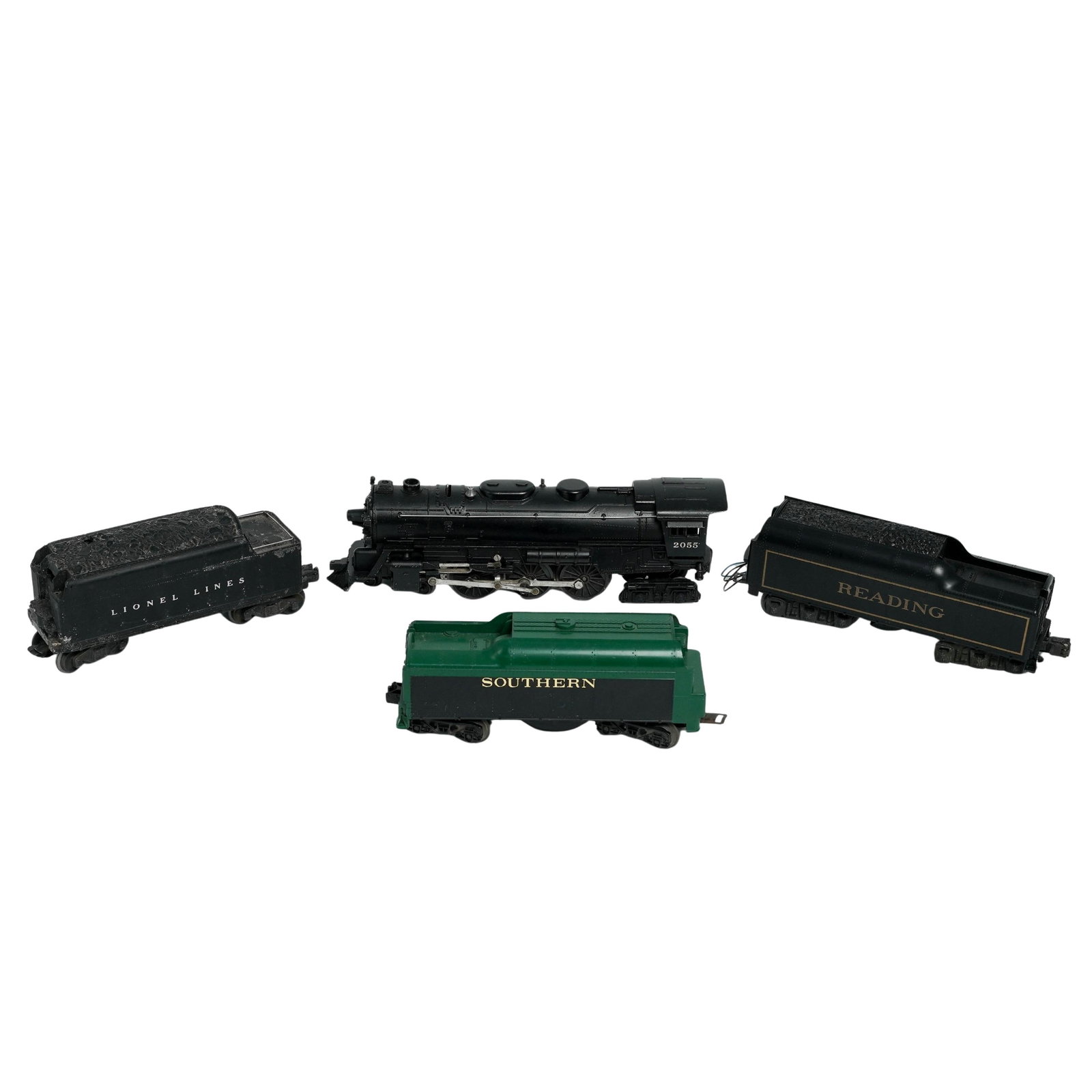 (4 pc) Vintage Model Train Components: (4 pc) Vintage Model Train Components c. 1950s-1980s, The lot includes: (1) Lionel 2055 Steam Locomotive, a black engine marked with the number "2055" on the side of the cab. This is a well known Lion