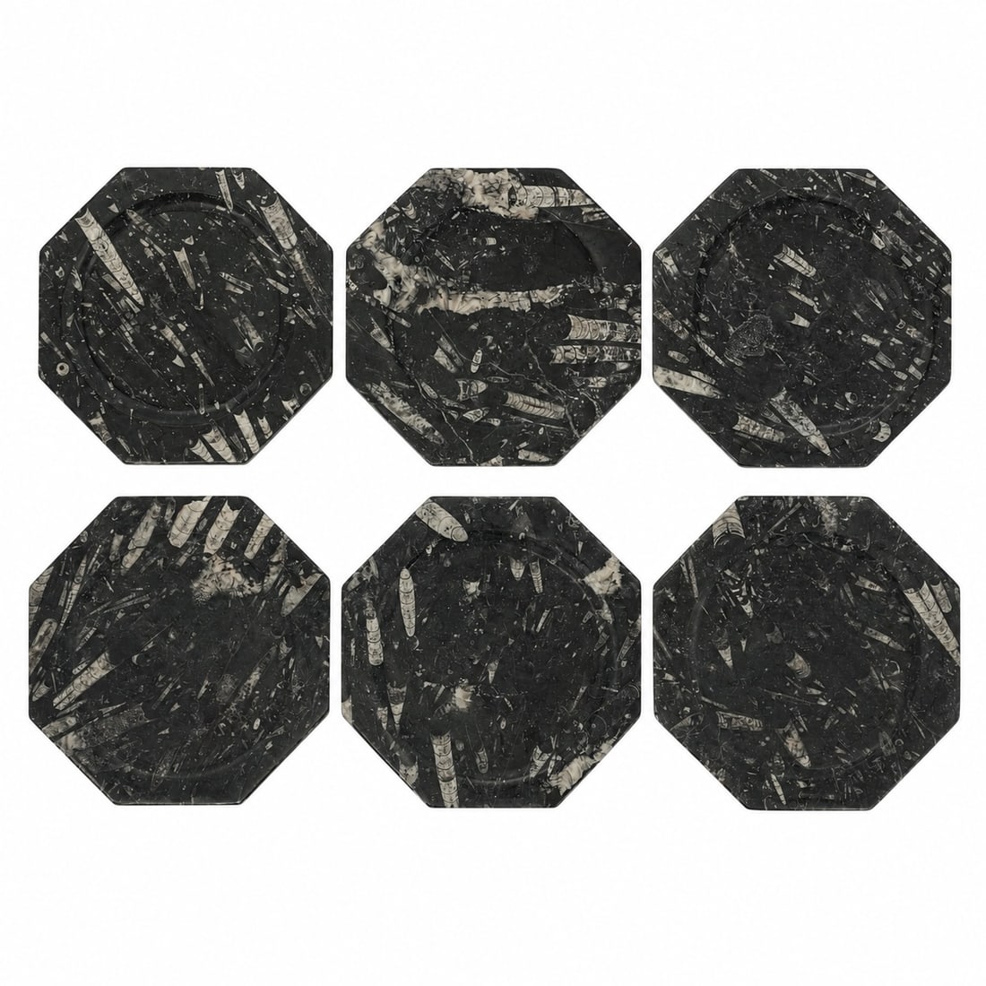 (6pc) Orthoceras Fossil Black Marble Plates: (6pc) Orthoceras Fossil Black Marble Plates Devonian Period. North Africa These octagonal plates are crafted from polished black limestone containing authentic Orthoceras fossils from the Atlas Mounta
