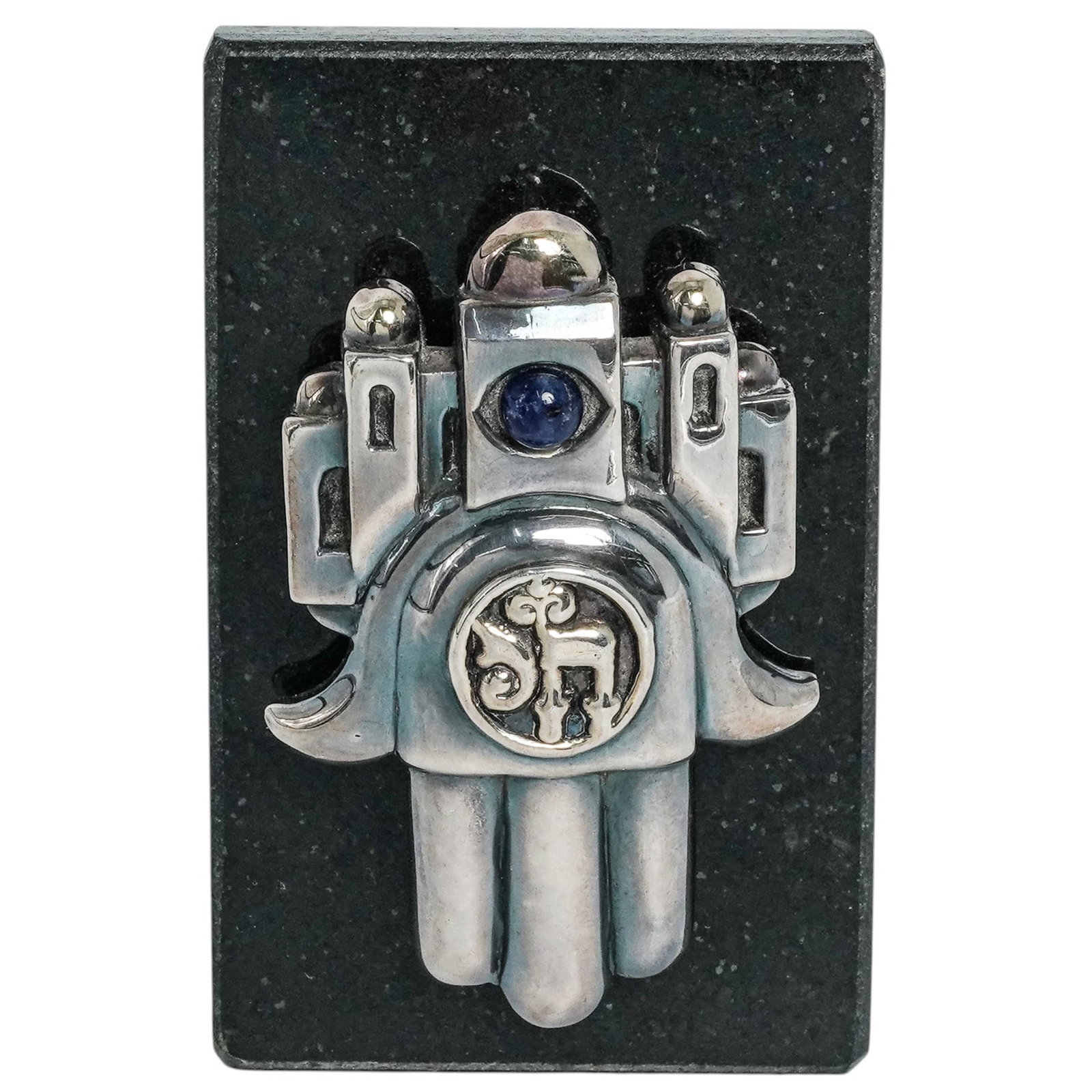 Frank Meisler (Israeli, 1929–2018) “Treasure of Kabbalah?? Silver-Overlay Hamsa Brooch with: Frank Meisler (Israeli, 1929–2018) “Treasure of Kabbalah” Silver-Overlay Hamsa Brooch with Stand Mid-20th Century, Israeli. Silver-overlay brooch in the form of a Hamsa, designed by Frank Me