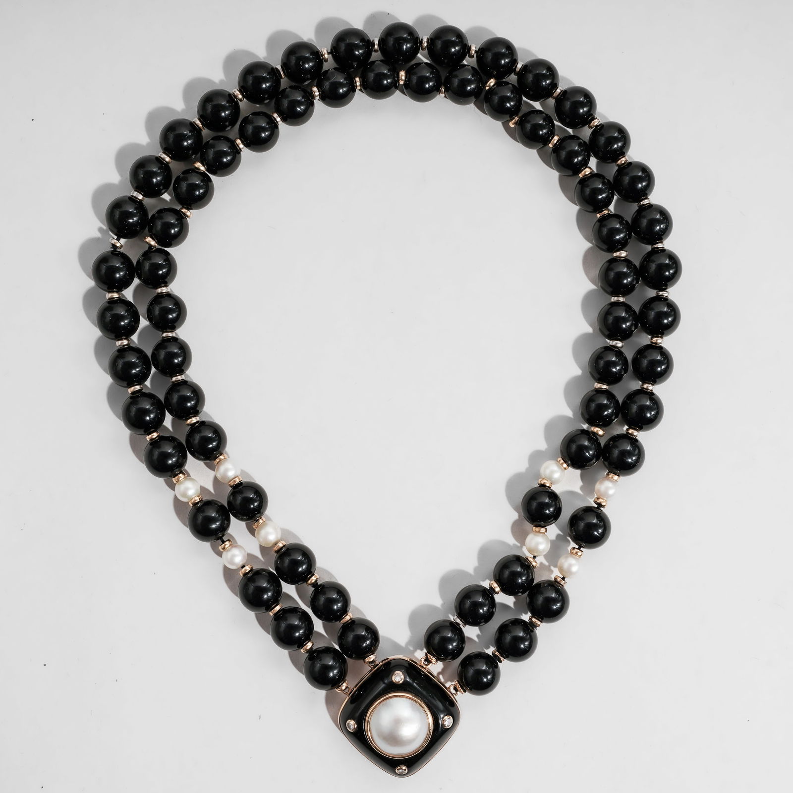 Vintage 14k Gold Onyx Pearl & Diamond Beaded Necklace: Vintage 14k Gold Onyx Pearl & Diamond Beaded NecklaceCirca: 1970s-1980s, European.Vintage beaded necklace composed of polished black onyx beads, interspersed with cultured pearls and gold plated space