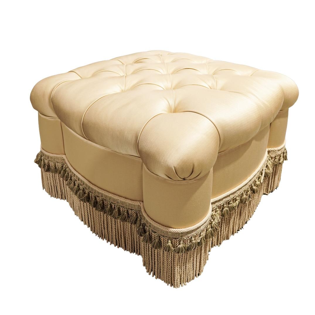 Transitional Gold Tufted Silk Blend Upholstered Ottoman: Transitional Gold Tufted Silk Blend Upholstered Ottoman20th centuryA tufted square ottoman with a fringe trim, Upholstered in a gold, silk blend fabric with deep even button tufting.H 20" W 31" L 32"