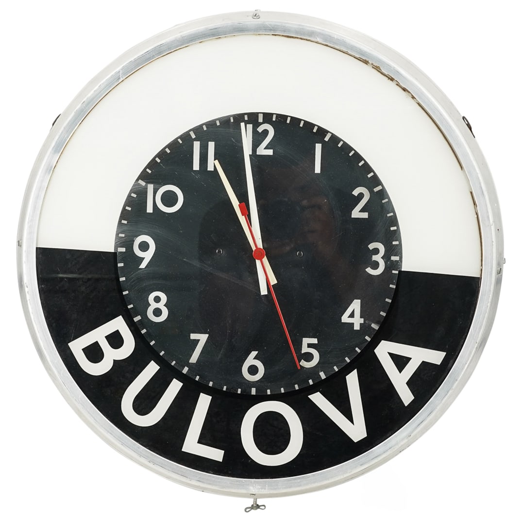 Mid-Century Bulova Black And White Wall Clock: Mid-Century Bulova Black And White Wall ClockMid 20th Cent. USAVintage Bulova wall clock featuring a chrome housing and a black and white face emblazoned "BULOVA". Tested; see condition.H: 22.75" W: 4