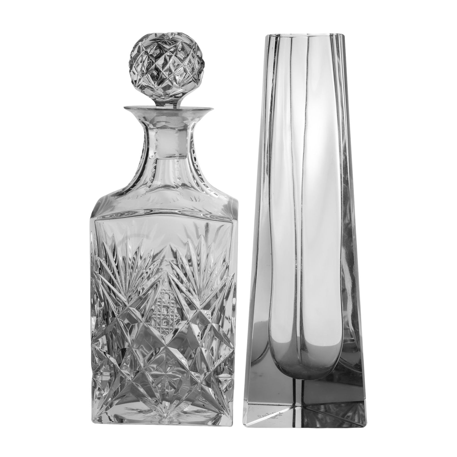St Louis Crystal Decanter & Cartier Crystal Vase: St Louis Crystal Decanter & Cartier Crystal Vase20th century, Francex1 Saint Louis crystal decanter, marked on bottom with Saint Louis hallmark.x1 A Cartier triangular crystal vase, marked on bottom e