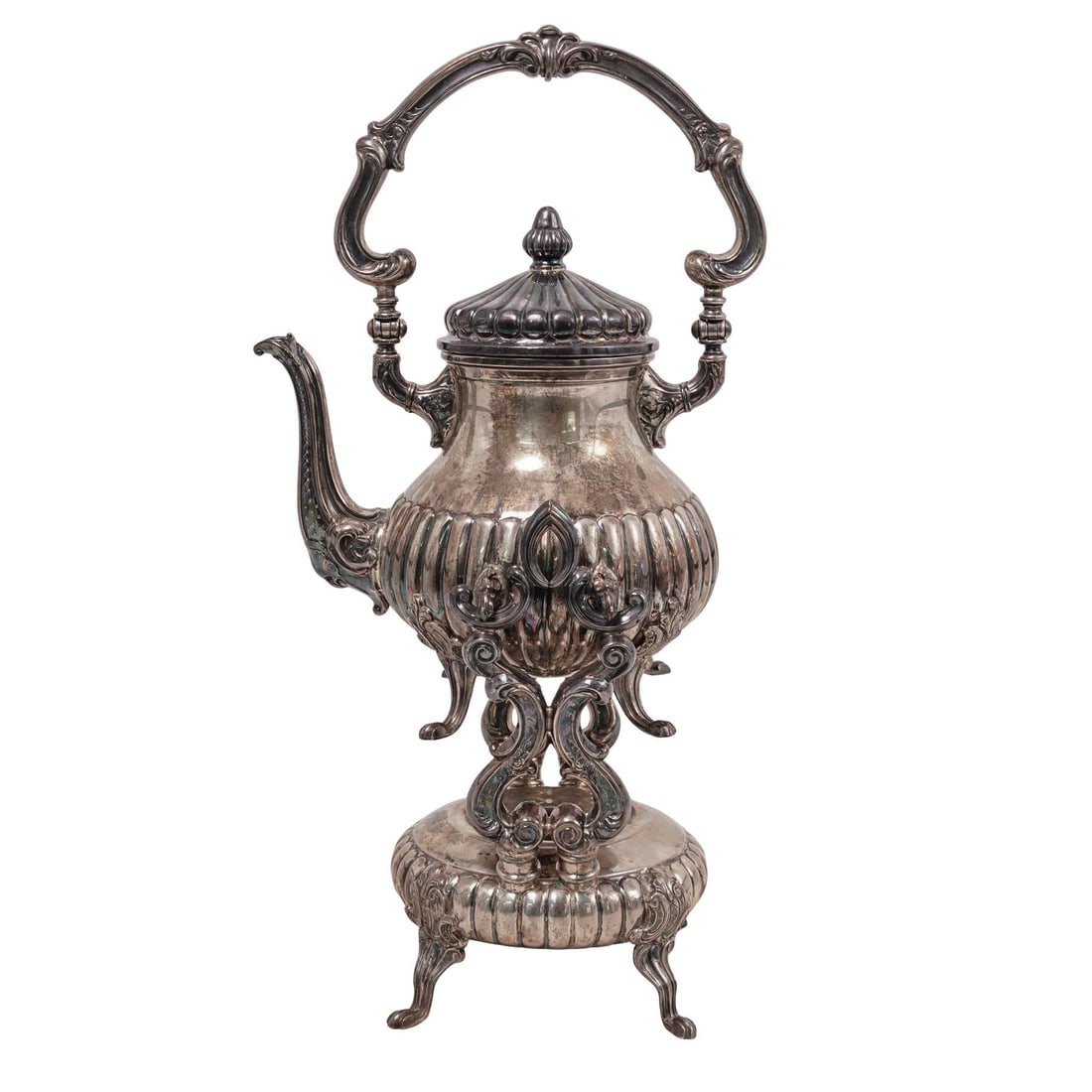 (2 pcs) Camusso Sterling Silver Tea Kettle and Stand: (2 pcs) Camusso Sterling Silver Tea Kettle and StandEarly 20th century, PeruCamusso sterling silver tea kettle and stand. Classical style sculpted detail and decorative work with clawed feet. Kettle a