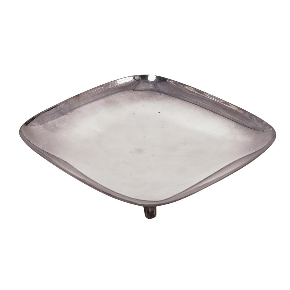 Vintage Silver Footed Catchall: Vintage Silver Footed CatchallMid 20th Cent.Vintage silver footed catchall of gently squared form with rounded corners, raised on four applied animal form feet.Total weight: 212 gramsH: 1" W: 6 3/8" D