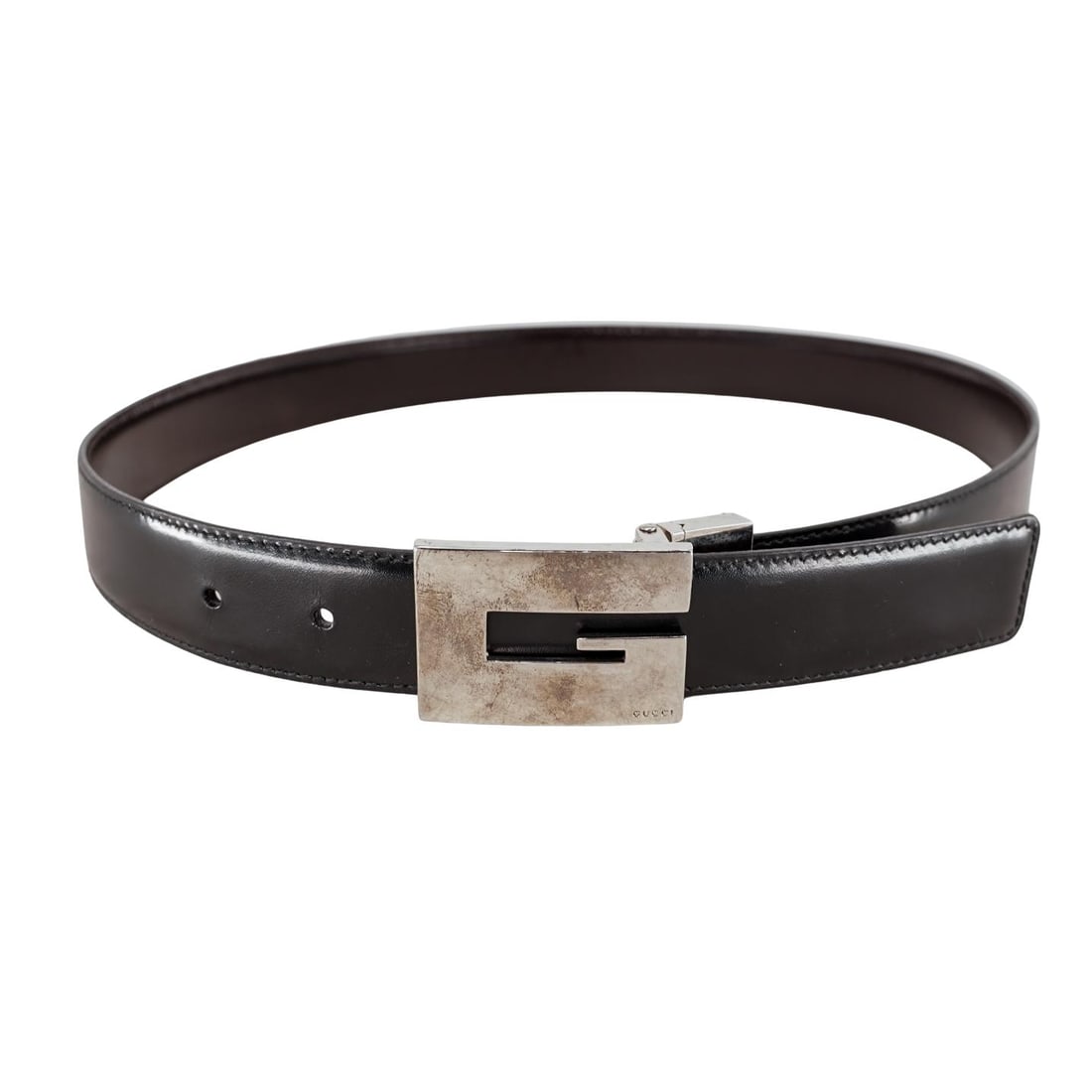Vintage Gucci "G" Buckle Black Leather Belt: Vintage Gucci "G" Buckle Black Leather Belt 20th century, Italy A vintage Gucci black leather belt with silver-plated "G" buckle. Marked on verso near buckle "Gucci made in Italy