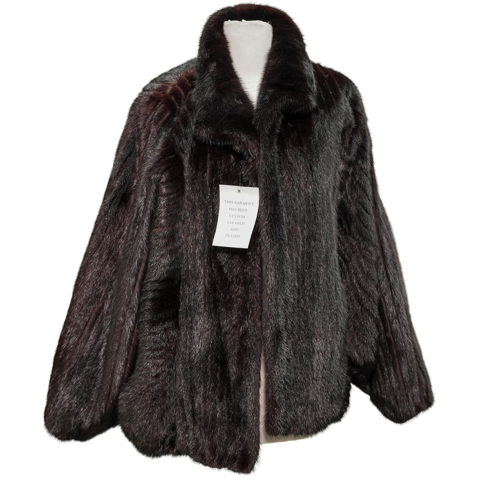 Vintage Dark Brown Mink Fur Coat: Vintage Dark Brown Mink Fur Coat Late 20th century A dark brown fur coat, likely mink. Marked inside black satin lining on lower right side with a tag reading "specialist clean only 100% cupra
