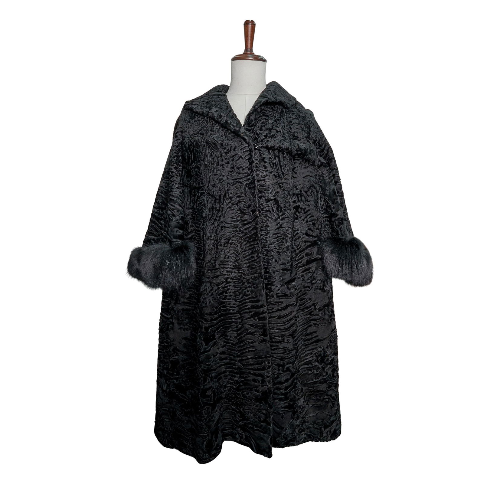 Vintage Black Persian Lamb Fur Coat: Vintage Black Persian Lamb Fur Coat Early to mid 20th Cent. Vintage black fur coat featuring the distinctive moire, wavy texture characteristic of Persian lam fur. The coat is tailored in structured,