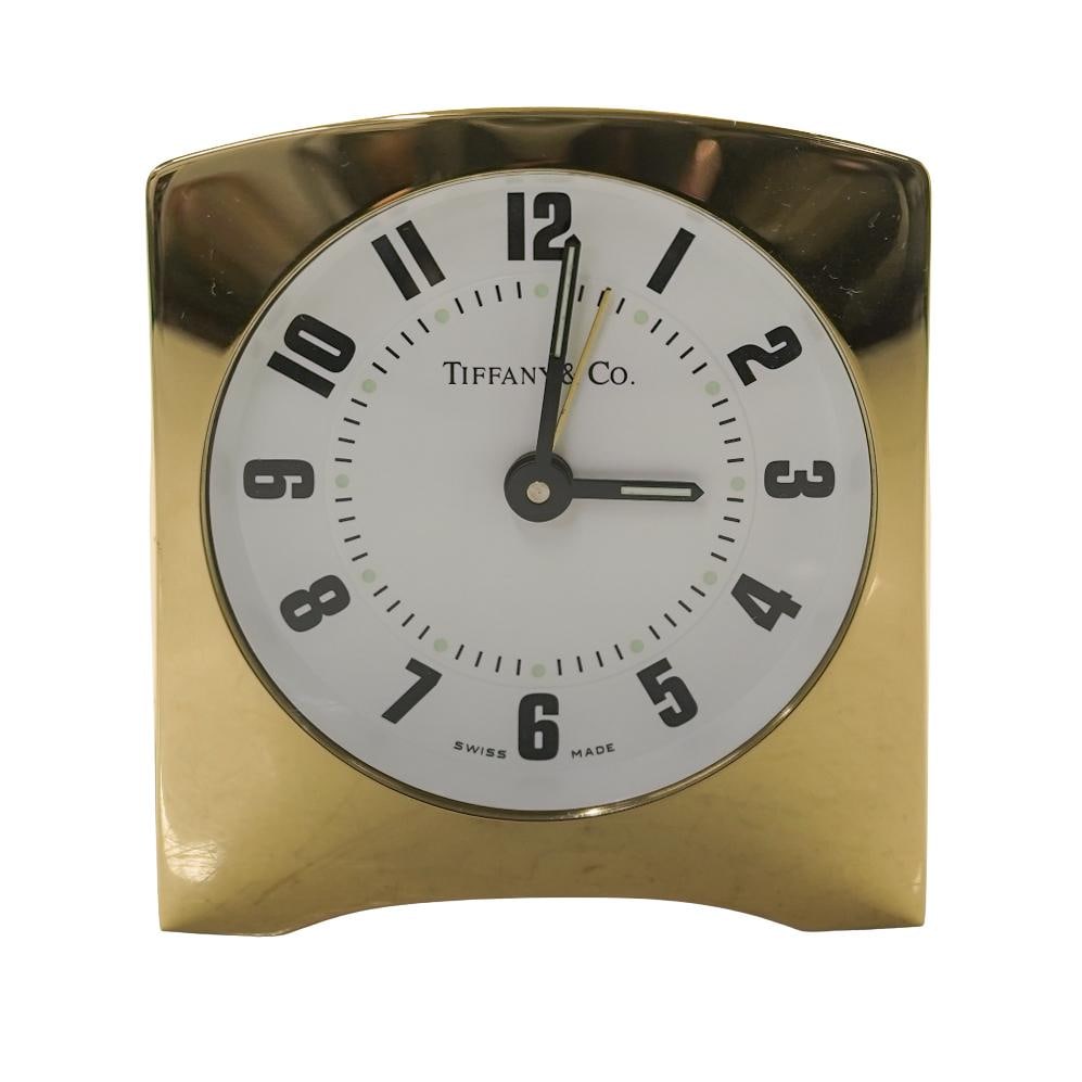 Tiffany and Co. Gold-Tone Quartz Desk Alarm Clock: Tiffany and Co. Gold-Tone Quartz Desk Alarm Clock20th century, AmericanTiffany and Co. gold-tone quartz desk alarm clock. Marked on clock face "Tiffany and Co.". Marked inside on movement: "Tiffany an
