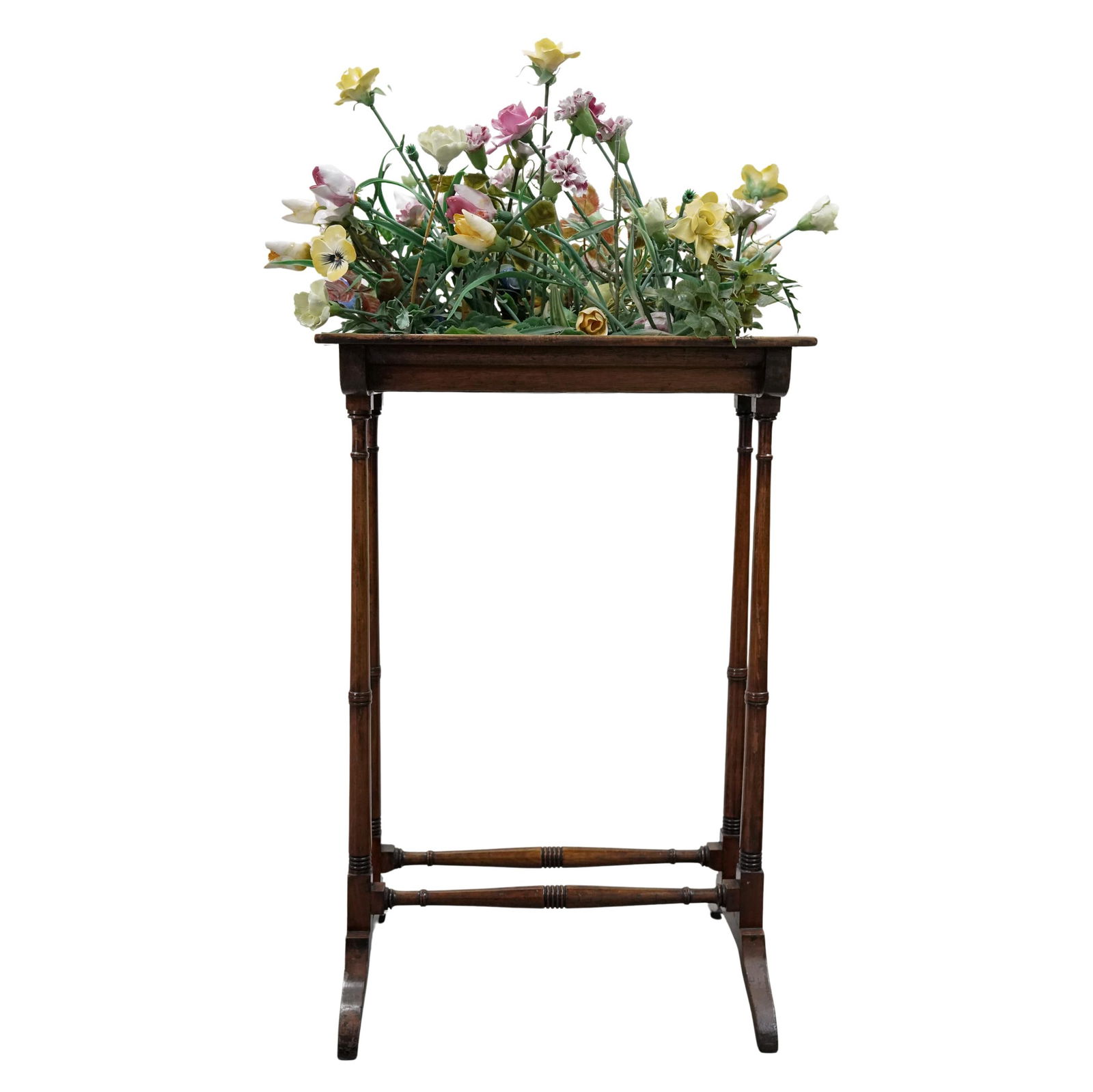 Vintage Porcelain Floral Arrangement: Vintage Porcelain Floral ArrangementEarly-mid 20th centuryA vintage decorative porcelain floral arrangement set into a wooden stand. Includes extra flowers.H 41" x W 13.75" x L 18.25"