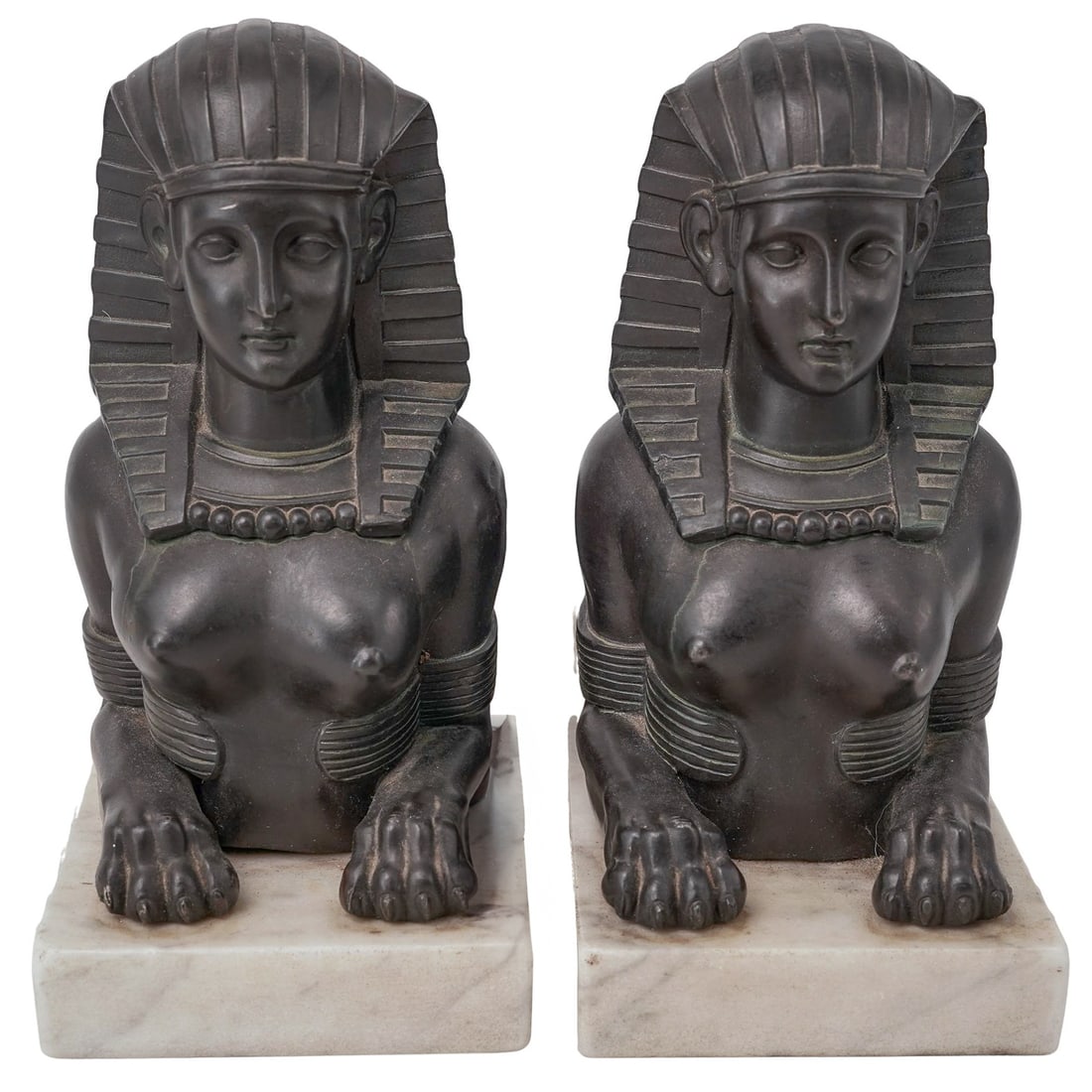 Pair of Egyptian Revival Mixed Metal Sphinx Statues: Pair of Egyptian Revival Mixed Metal Sphinx Statues20th Cent., EuropeanAntique French patinated mixed metal sphinx sculptures mounted to white marble bases.H: 9" W: 4.75" L: 11.5"