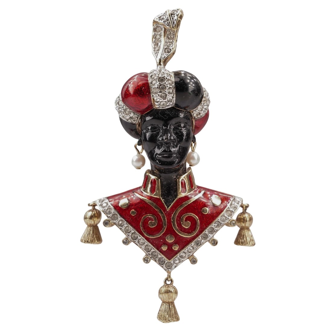 Butler and Wilson Gilt Enamel Rhinestone Blackamoor Brooch: Butler and Wilson Gilt Enamel Rhinestone Blackamoor Brooch20th century, EnglishButler & Wilson gold tone Blackamoor brooch with black, red, and gilt enamel detailing and clear rhinestone accents. Mark