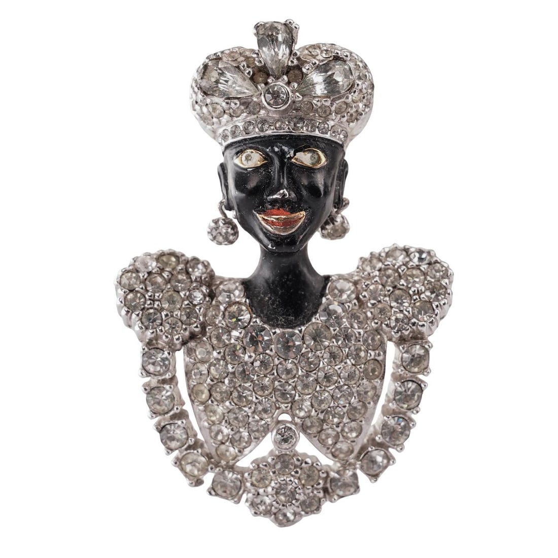 Vintage Ciner Enamel Rhinestone Blackamoor Brooch: Vintage Ciner Enamel Rhinestone Blackamoor Brooch Early 20th century, American This is a vintage blackamoor brooch featuring black enamel over silver-plated metal, rhinestone detailing. Marked