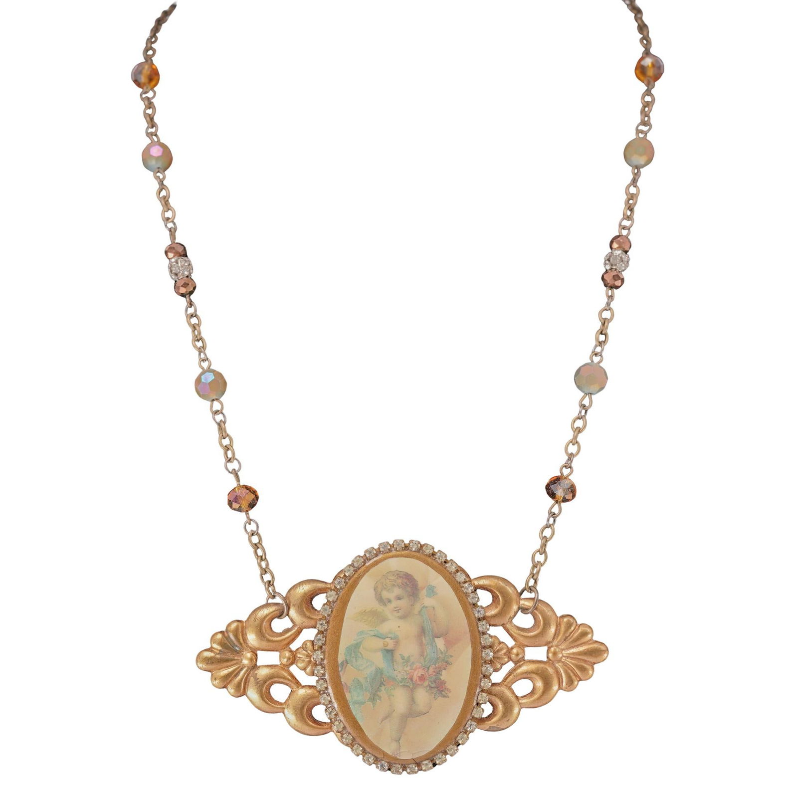 Victorian Brass Cherub Cameo Necklace: Victorian Brass Cherub Cameo NecklaceLate 19th centuryA Victorian brass necklace featuring a large cameo of a cherub with glass and rhinestone beaded details. Marked on back by hand "JB".L (unclasped)
