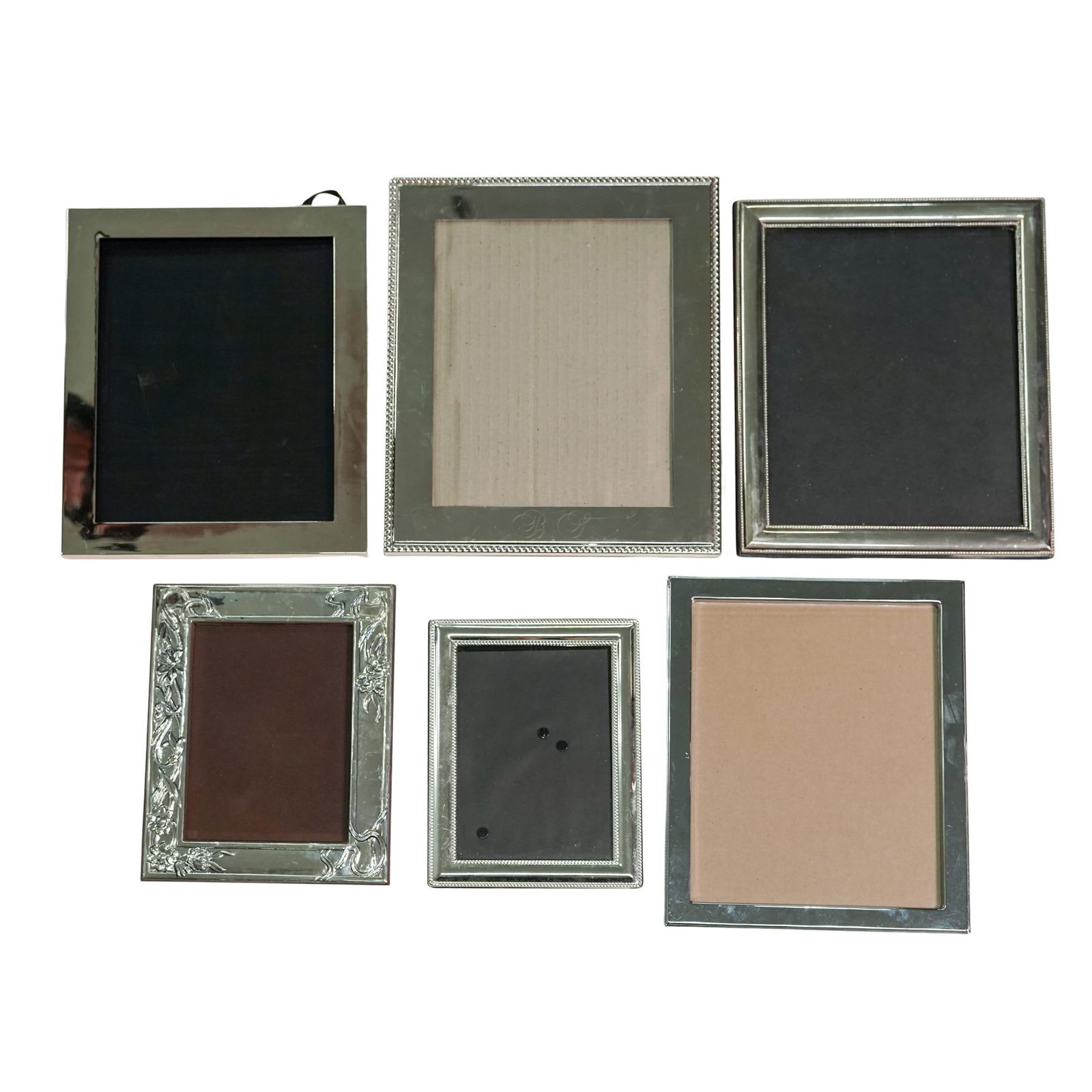 (6 pc) Silver Plated & Stainless Steel Photo Frames: (6 pc) Silver Plated & Stainless Steel Photo Frames20th century, USA, China, England.Lot includes six various sizes picture frames.Biggest : 10.5" x 12.5" picture opening :7.5" x 9.5" / Smallest : 6.5