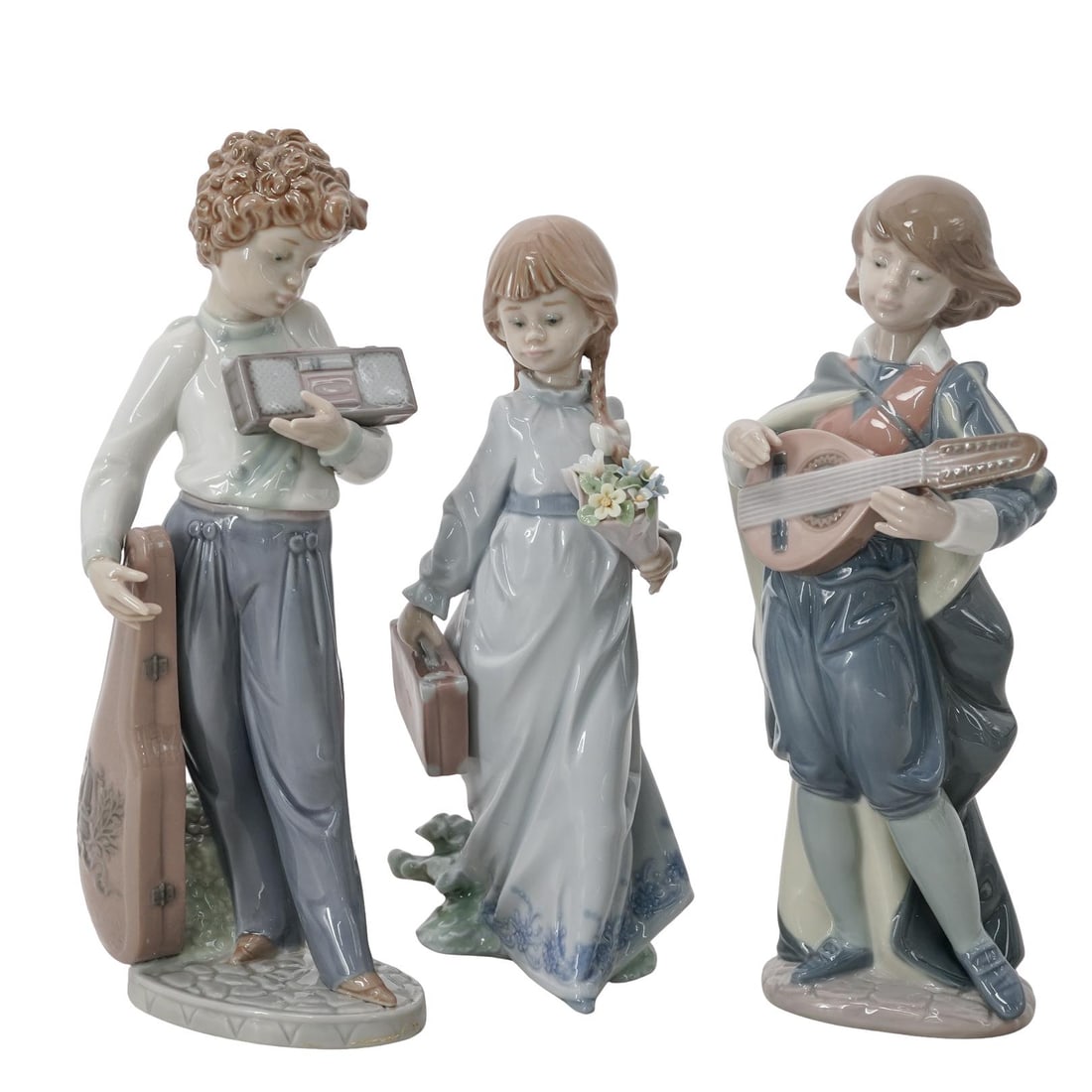 (3 pc) Lladro Porcelain Figurines: (3 pc) Lladro Porcelain Figurines20th century, SpanishLot includes:1) "School Days" # 7604, Issued 1988, retired same year, Sculptor Antonio Ramos1) "Young Mandolin Player" # 6278, Issued 1996, retire