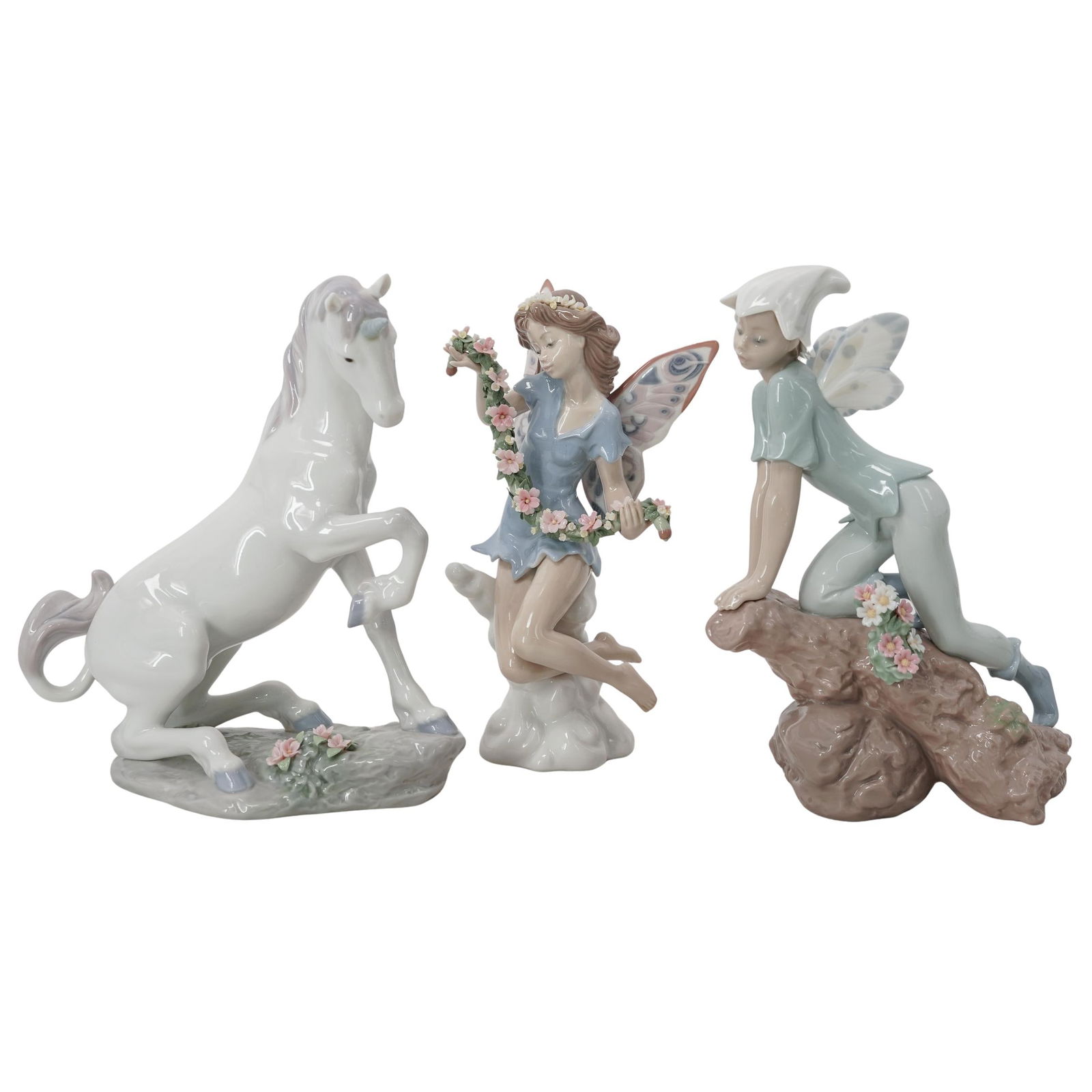 (3 pc) Lladro Porcelain Figurines: (3 pc) Lladro Porcelain Figurines 20th century, Spanish Lot includes : 1) "Prince of the Elves (# 7690) this figurine issued in 2001, retired in 2003, depicts elf sitting on a tree branch. Sculpted