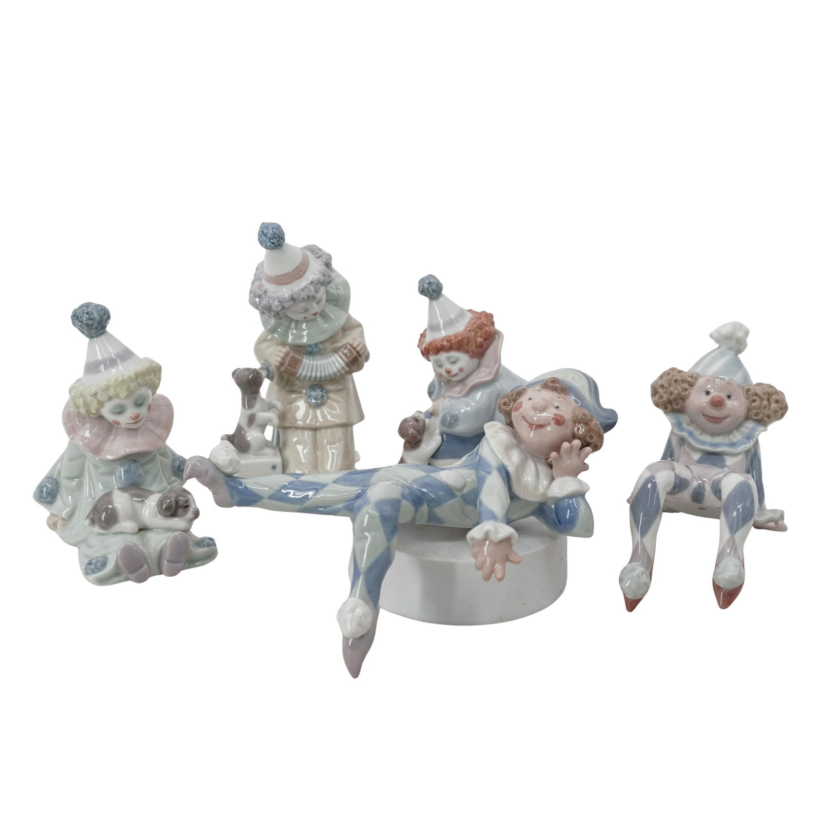(5 Pc) Lladro Porcelain Clown Figurines: (5 Pc) Lladro Porcelain Clown Figurines20th c., SpainLot of five glazed clown figurines with Lladro backstamps including:Ragamuffin 1001500Neglected Harlequin 1001503Pierrot with Puppy 1005277Pierrot