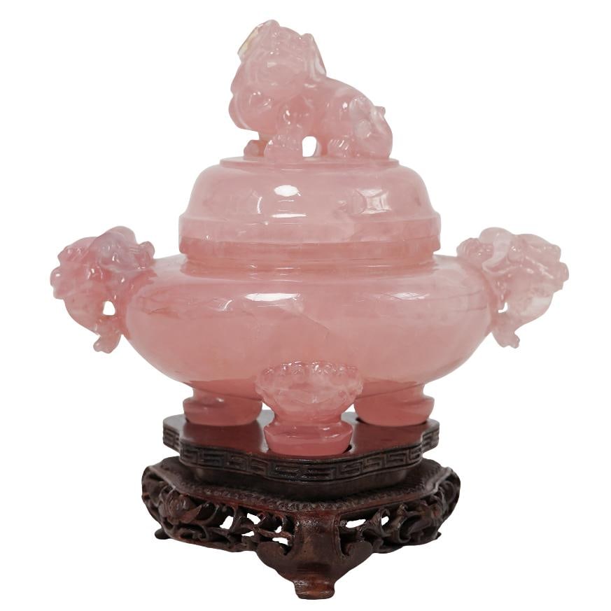 Chinese Carved Rose Quartz Censor: Chinese Carved Rose Quartz CensorRepublic Period, ChinaHand carved rose quartz Chinese censer with foo dog finial lid on a fitted wooden stand. The design includes elephant heads as the handles.H. 5.5