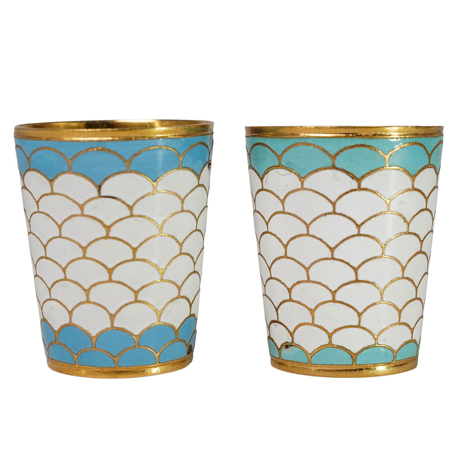 Pair of Russian Enameled Shot Glasses: Pair of Russian Enameled Shot GlassesEarly 20th century, RussianA pair of Russian enameled shot glasses with blue and white scalloped "fish tail" patterns and gilt gold wash. Marked on bottom with sta