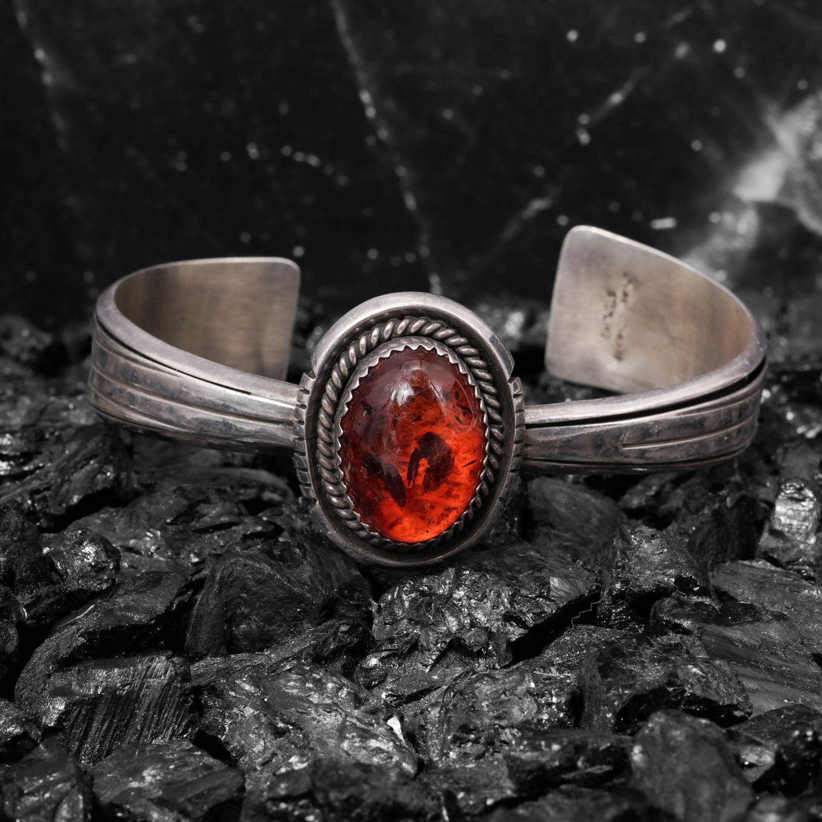 Ray Begay Vintage Navajo Sterling Silver & Amber Ring: Ray Begay Vintage Navajo Sterling Silver & Amber RingCirca: 1970s-1980s, USAVintage Navajo Sterling silver ring by Ray Begay. Centered by a domed natural amber cabochon measuring approximately 18 