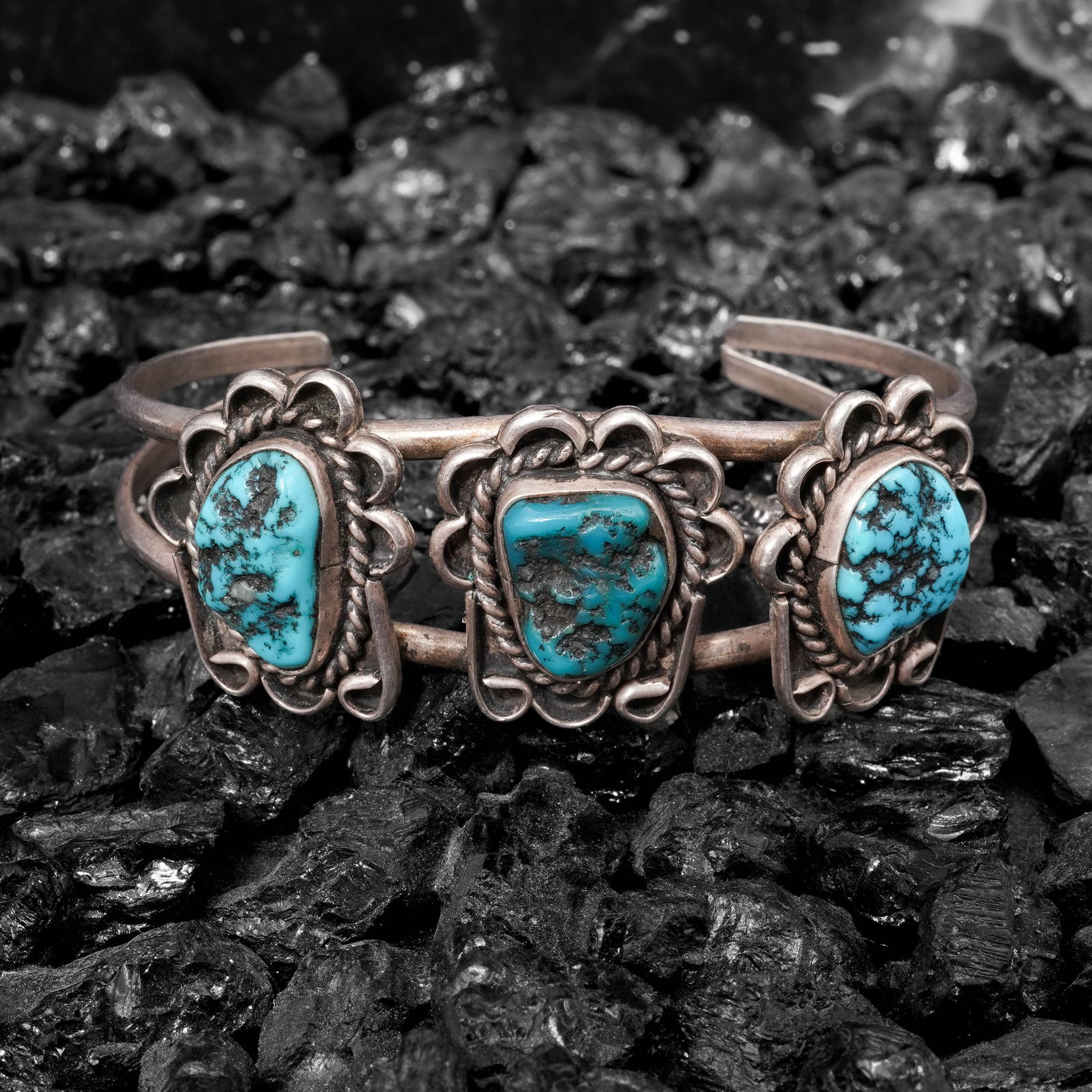 Carl Sandia Vintage Navajo Sterling Silver & Turquoise Cuff Bracelet: Carl Sandia Vintage Navajo Sterling Silver & Turquoise Cuff BraceletCirca 1970s-1980s, USAVintage Navajo sterling silver cuff by Carl Sandia. The bracelet is constructed with three natural turquoise c