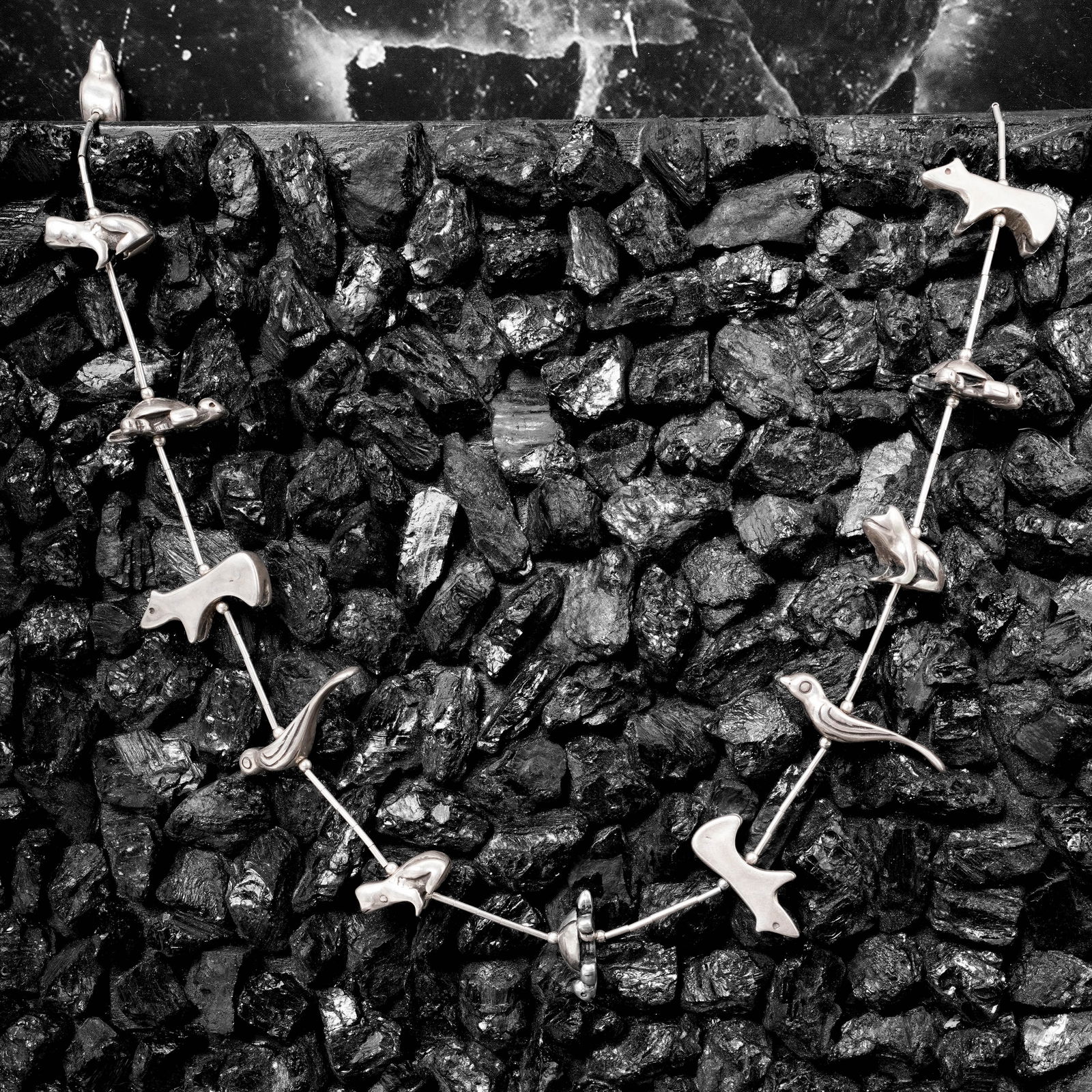 Vintage Navajo Stirling Silver Animal Fetish Necklace Signed: Vintage Navajo Stirling Silver Animal Fetish Necklace SignedCirca 1950s-1970s, USAVintage Navajo sterling silver necklace featuring a repeating sequence of abstract animal motif links spaced along a f