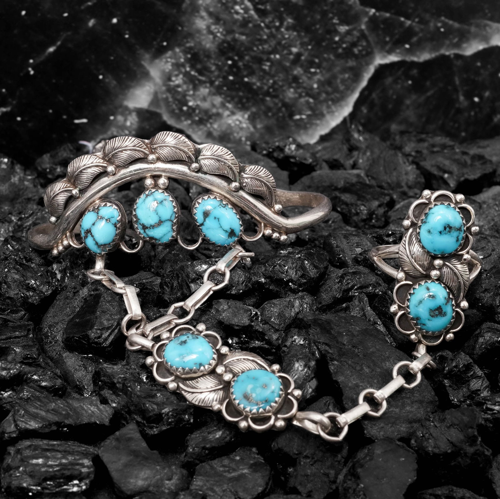 Vintage Sterling Silver & Turquoise Slave Bracelet Signed: Vintage Sterling Silver & Turquoise Slave Bracelet SignedCirca 1970s-1980s, USASterling silver hand-chain bracelet constructed with a hinged crescent wrist cuff connected by a rolo-link chain to a flo