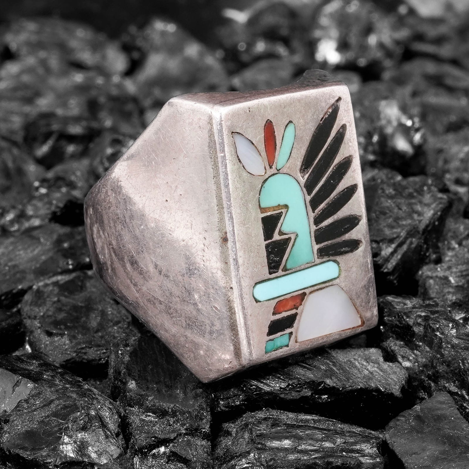 Vintage Zuni Sterling Silver Inlay Ring Signed: Vintage Zuni Sterling Silver Inlay Ring SignedCirca 1960s-1970s, USARectangular plaque ring constructed of a heavy silver shank fitted with a flush inlay panel depicting a stylized thunderbird figure.
