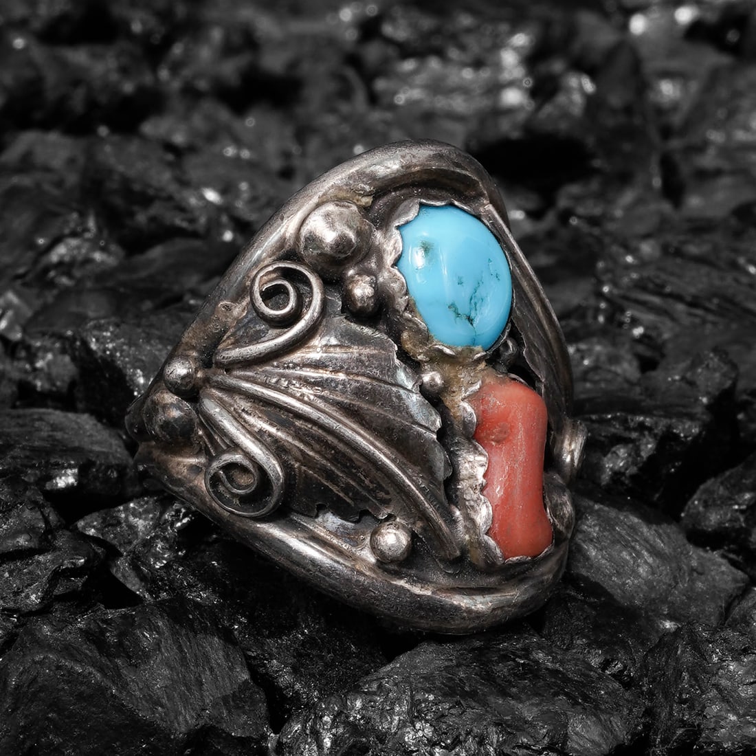 Vintage Navajo Stirling Silver Turquoise & Coral Ring: Vintage Navajo Stirling Silver Turquoise & Coral RingCirca 1950s-1960s, USAVintage Navajo silver ring centered by a round blue turquoise cabochon measuring approximately 7.5 Ã— 6.5 mm paire
