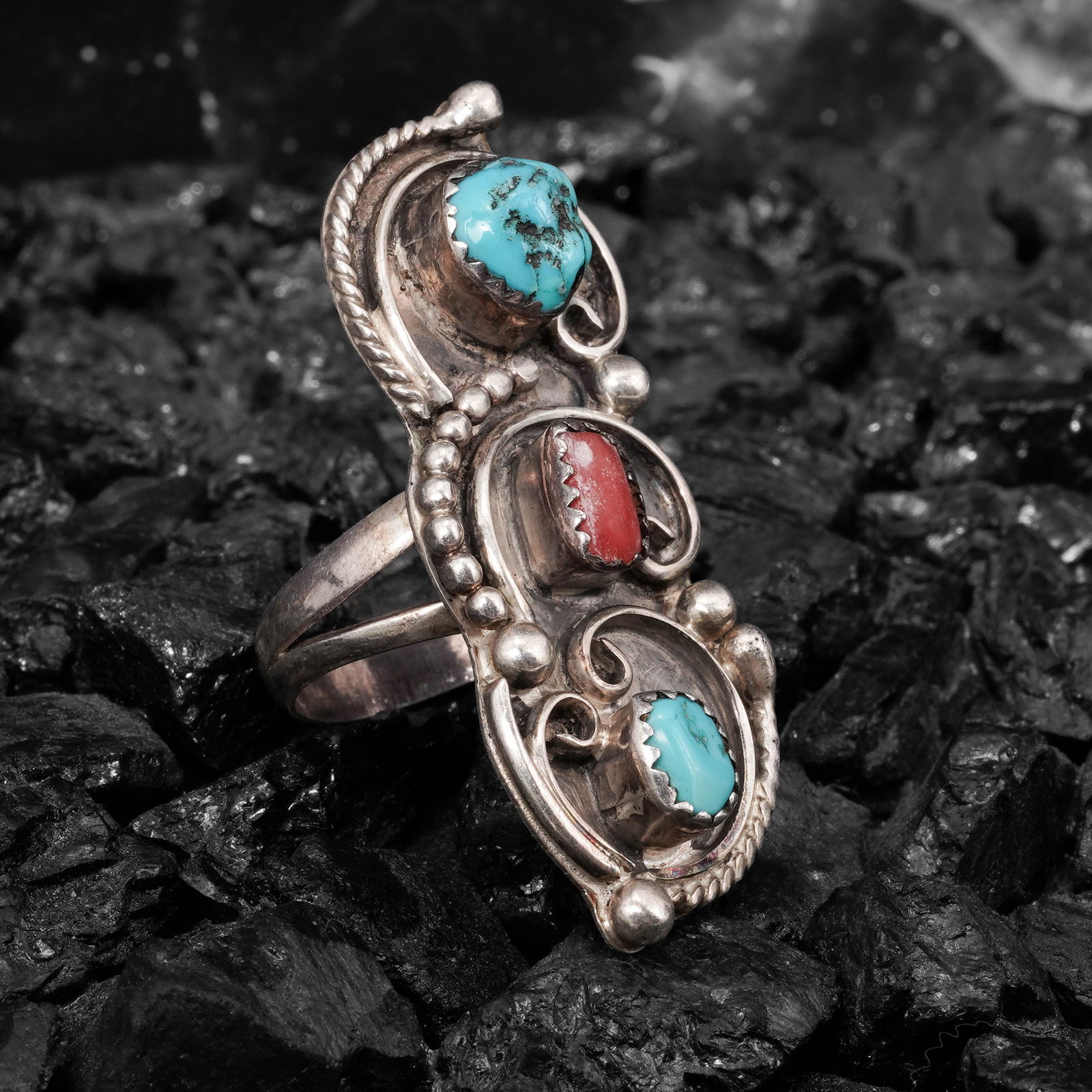 Vintage Rita Clark Sterling Silver Turquoise & Coral Ring: Vintage Rita Clark Sterling Silver Turquoise & Coral RingCirca 1970s -1980s, USAVintage Navajo sterling silver ring by Rita Clark, featuring a horizontal three-stone arrangement composed of two turquo