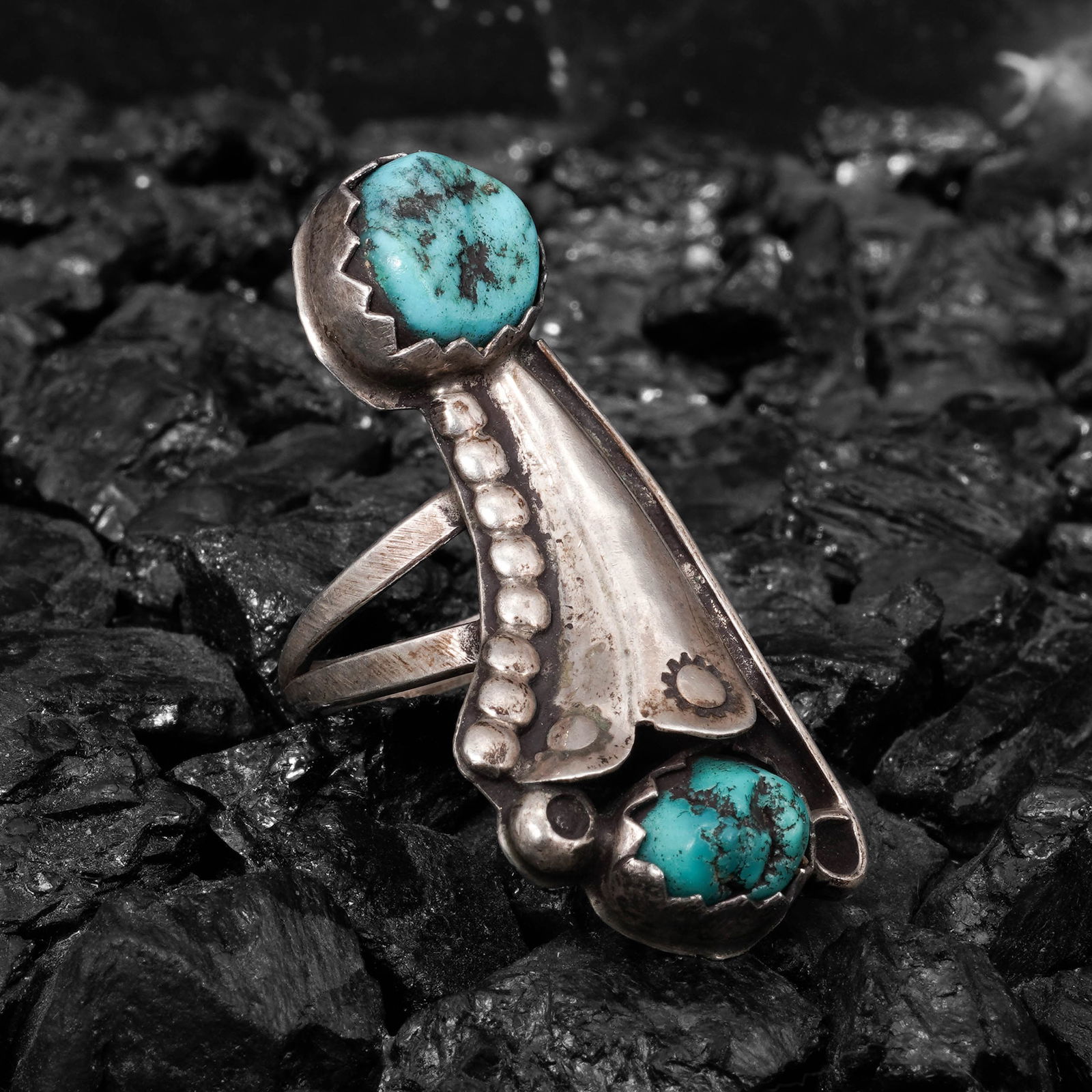 Bobby Johnson Navajo Sterling Silver & Turquoise Ring: Bobby Johnson Navajo Sterling Silver & Turquoise RingCirca 1980s -1990s, USAStirling silver ring by Bobby Johnson designed as a miniature squash blossom form, constructed with a central oval turquoise