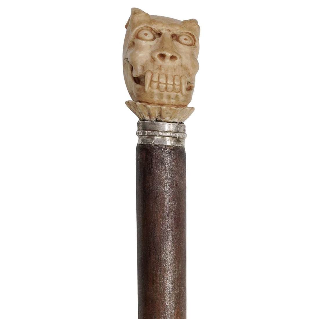 Antique Carved Bone & Sterling Silver Memento Mori Cane: Antique Carved Bone & Sterling Silver Memento Mori CaneLate 19th-Early 20th c.Antique wood cane featuring a carved bone horned skull handle with a sterling silver accent ring underneath. The ring is s