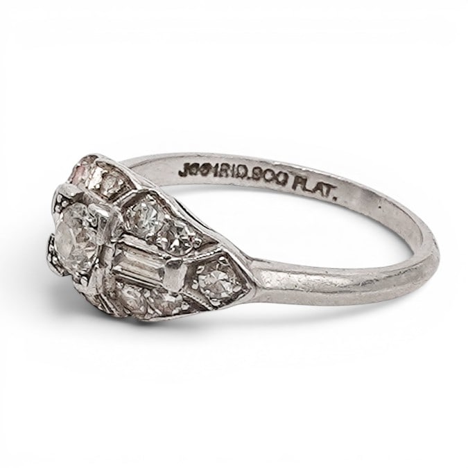 Art Deco Platinum Iridium & Diamond Ring: Art Deco Platinum Iridium & Diamond Ring 1920s-1930s, USA 900 platinum iridium Art Deco ring with pierced navette-form top, central old European cut diamond, baguette-cut diamond shoulders, and small 