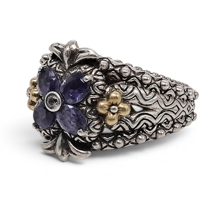 Barbara Bixby Sterling Silver & 18k Gold Iolite Flower Ring: Barbara Bixby Sterling Silver & 18k Gold Iolite Flower Ring 2000s, Chinese Sterling silver floral ring by Barbara Bixby featuring four faceted oval iolites arranged as a flower surrounding a bezel-set