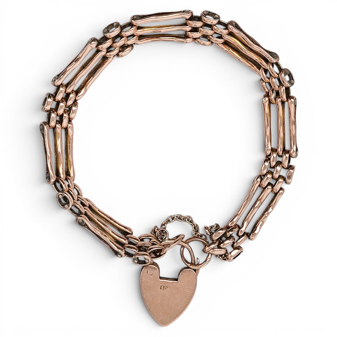 Victorian 9ct Gold Gate Bracelet with Heart Padlock: Victorian 9ct Gold Gate Bracelet with Heart Padlock 1890s-1910s, English 9ct yellow gold Victorian gate bracelet with articulated multi-row bar-link construction, heart-form padlock clasp, safety chai