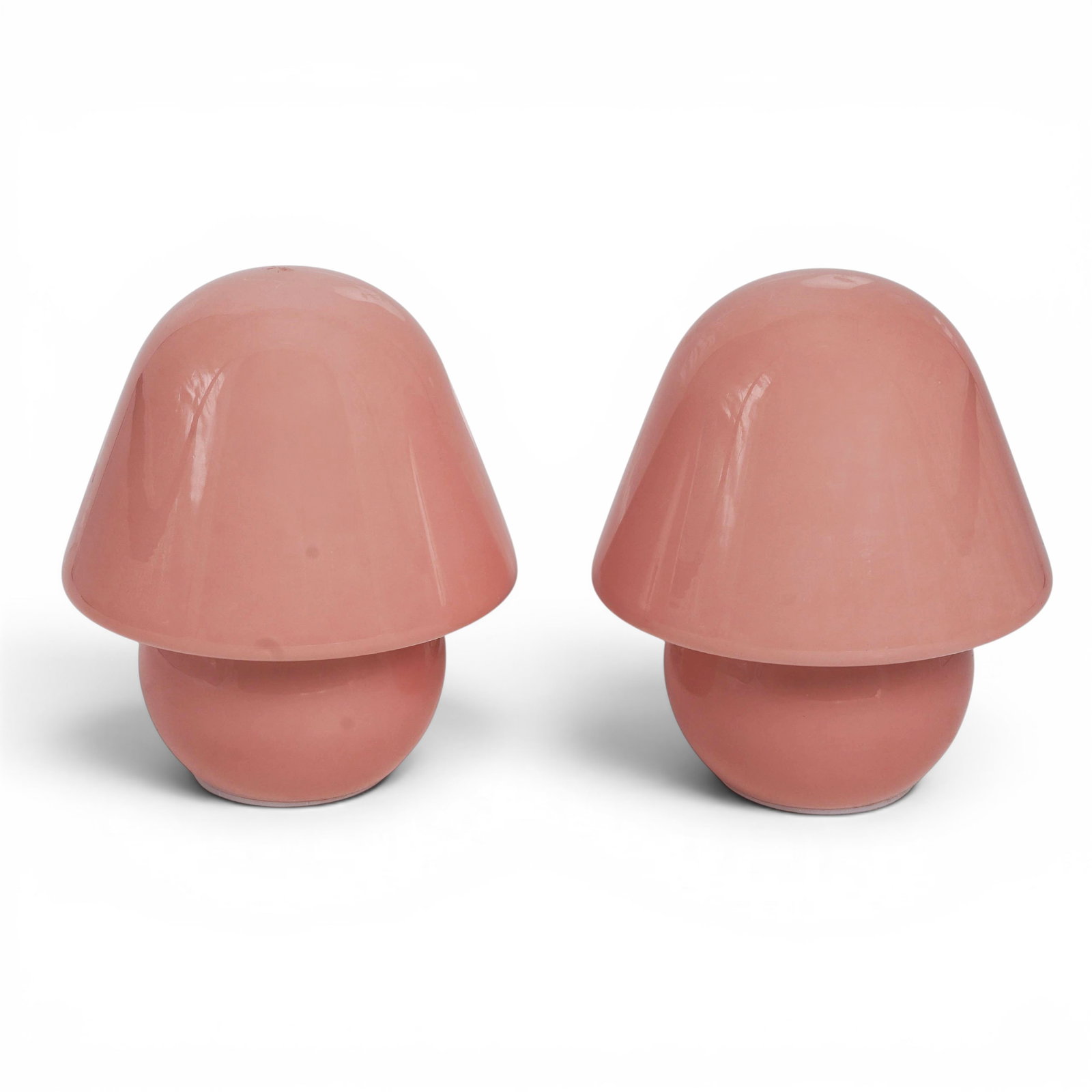 Pair Murano Pink Glass Mushroom Table Lamps: Pair Murano Pink Glass Mushroom Table Lamps MCM, Italy The pink glass mushroom table lamps feature a minimalist mid century modern "mushroom" shape, consisting of a single, continuous glossy piece whe