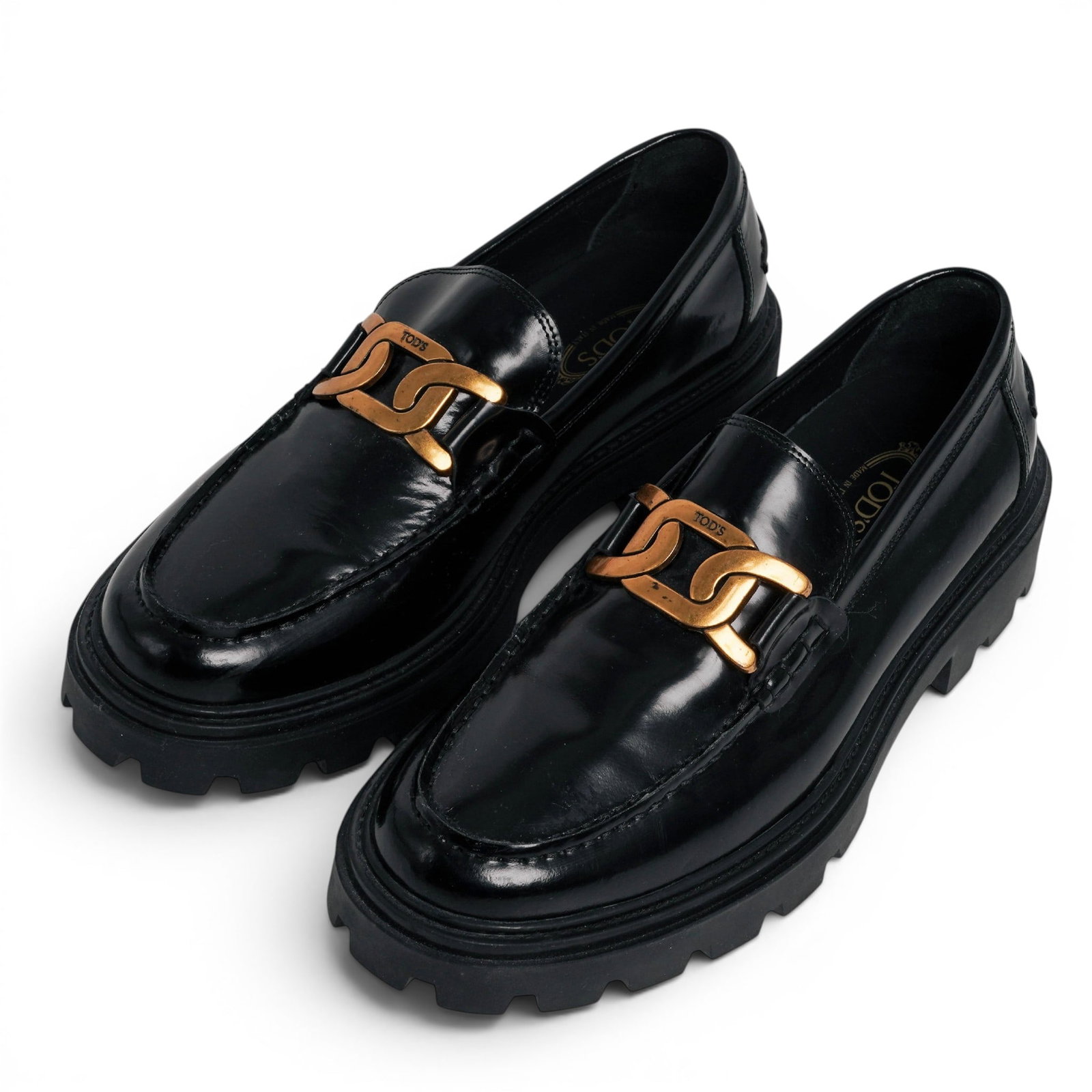 Tod's Gomma Pesante Leather Loafers: Tod's Gomma Pesante Leather Loafers Late 20th Century, Italy Tod's Gomma Pesante black polished leather loafers featuring the iconic oversized gold-tone chain hardware and substantial lug rubber