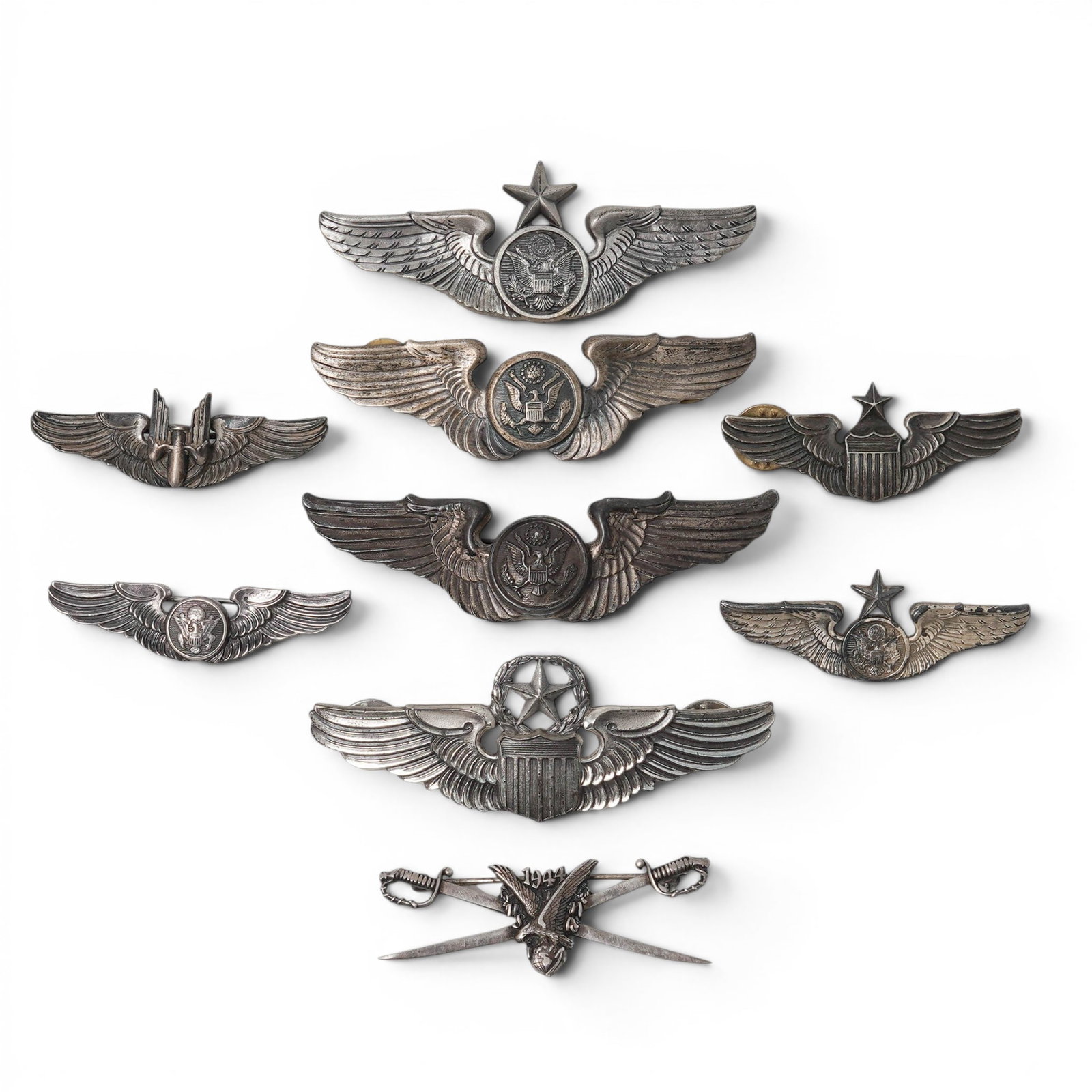 (9 pc) Sterling & Silver Plated WWII USAAF Aircrew Member Badges: (9 pc) Sterling & Silver Plated WWII USAAF Aircrew Member Badges WWII, USA United States sterling and silver-plated USAAF aircrew member badges comprising eight examples marked "Sterling" on the rever